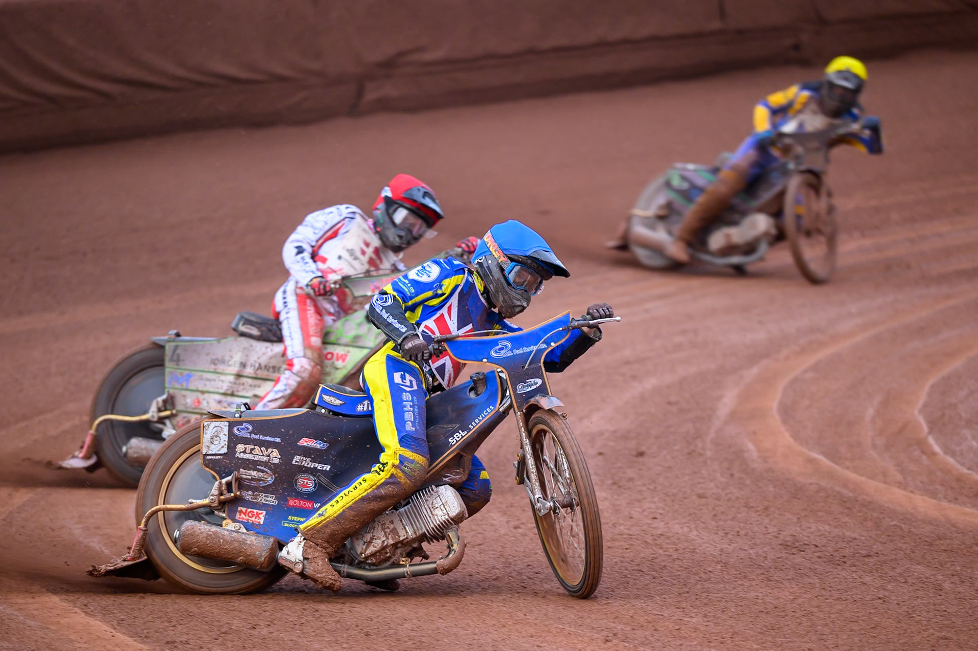 Anders Rowe of Great Britain in Blue leading Jonas Knudsen of Denmark in Red and Daniel Klima of Czechia in Yellow during the Speedway GP Qualifying Round 3 at Allied Ashfield Stadium, Glasgow on Saturday 30th May 2026. (Photo: Ian Charles | MI News)