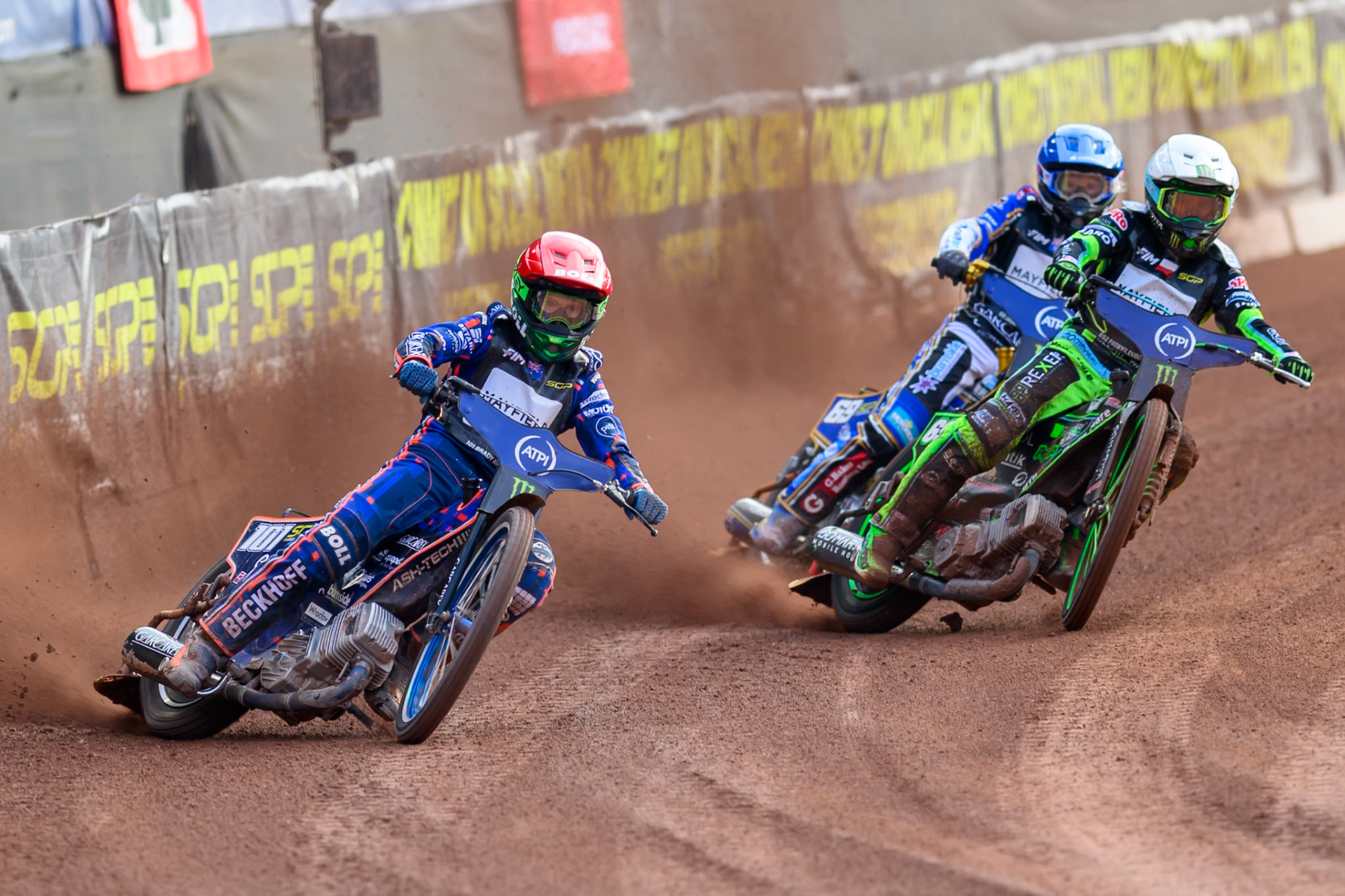 Brady Kurtz (101) of Australia in Red leading Patryk Dudek (692) of Poland in White and Jason Doyle (69) of Australia in Blue during the ATPI  FIM Speedway GP of Manchester at the National Speedway Stadium, Manchester on Friday 5th June 2026. (Photo: Ian Charles | MI News)
