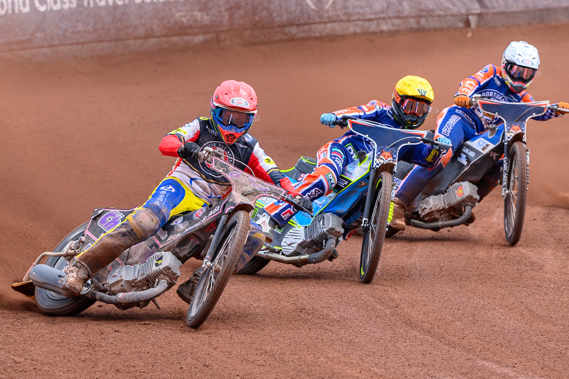 Leon Flint, Guest Rider for Belle Vue Aces in Red leading Jaimon Lidsey of Northampton Foxes in Yellow and Nicolai Klindt of Northampton Foxes during the Rowe Motor Oil Premiership match between Belle Vue Aces and Northampton Foxes at the National Speedway Stadium, Manchester on Monday 4th May 2026. (Photo: Ian Charles | MI News)