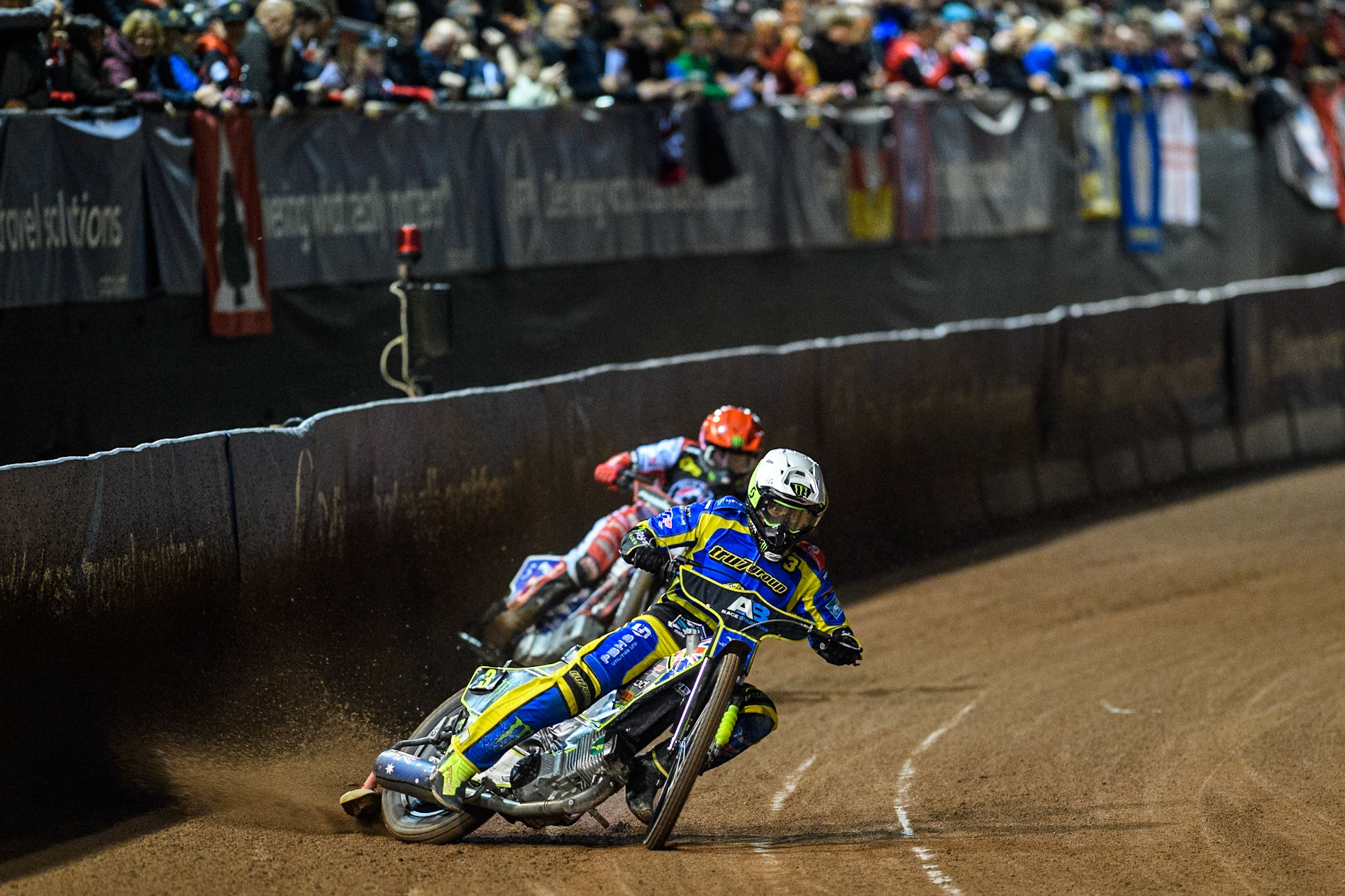 Sheffield Tigers' Chris Holder  in White leading Belle Vue Aces' Dan Bewley  in Red during the Rowe Motor Oil Premiership Play Off Semi Final 2, 1st Leg match between Belle Vue Aces and Sheffield Tigers at the National Speedway Stadium, Manchester on Monday 16th September 2024. (Photo: Ian Charles | MI News)