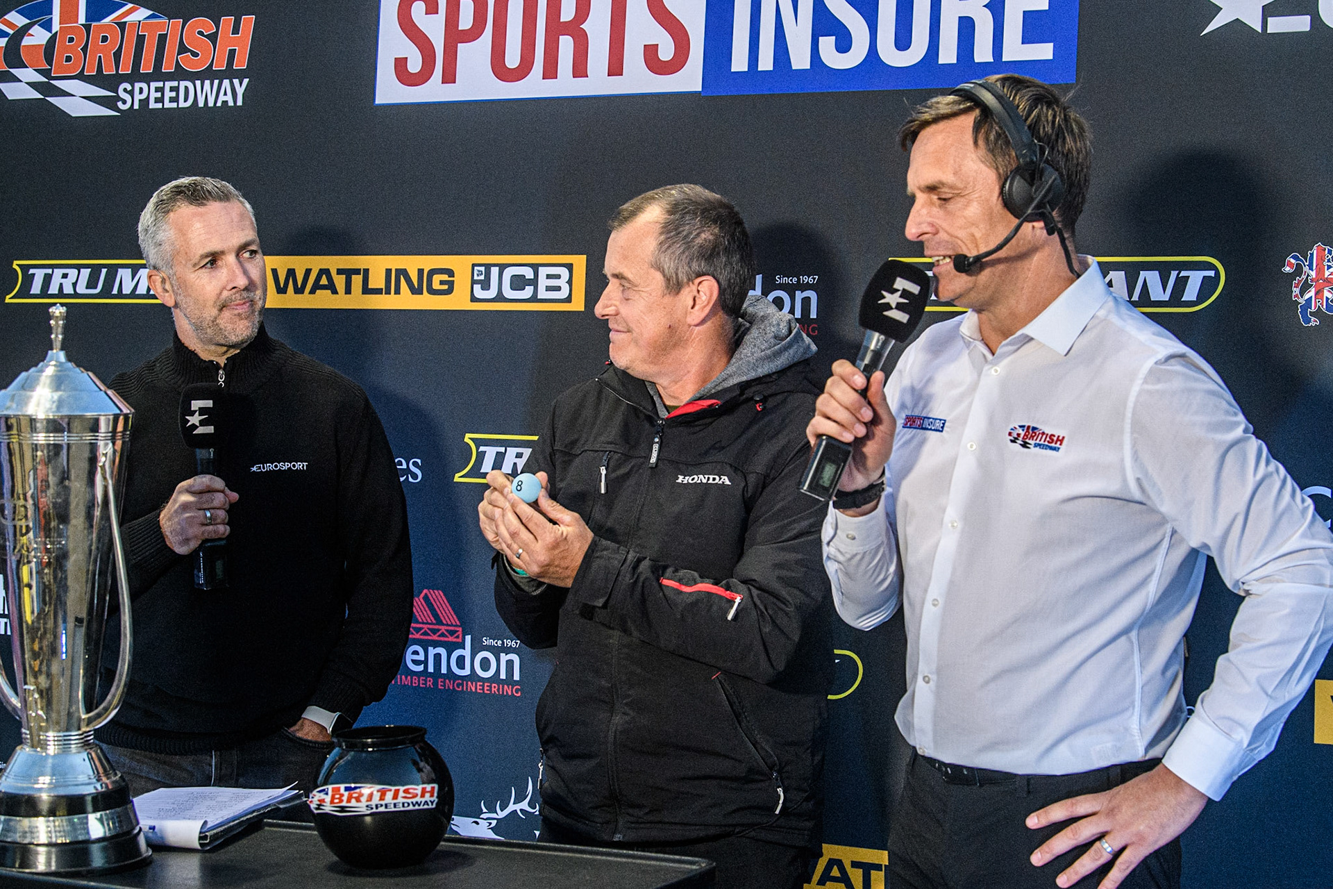 The Draw for the British Final is made, introduces by Scott Nicholls (left). Draw made by TT Champion John McGuinness (Centre) with Premiership CEO Phil Morris (right) during the Sports Insure Premiership match between Belle Vue Aces and Sheffield Tigers at the National Speedway Stadium, Manchester on Monday 7th August 2023. (Photo: Ian Charles | MI News)
