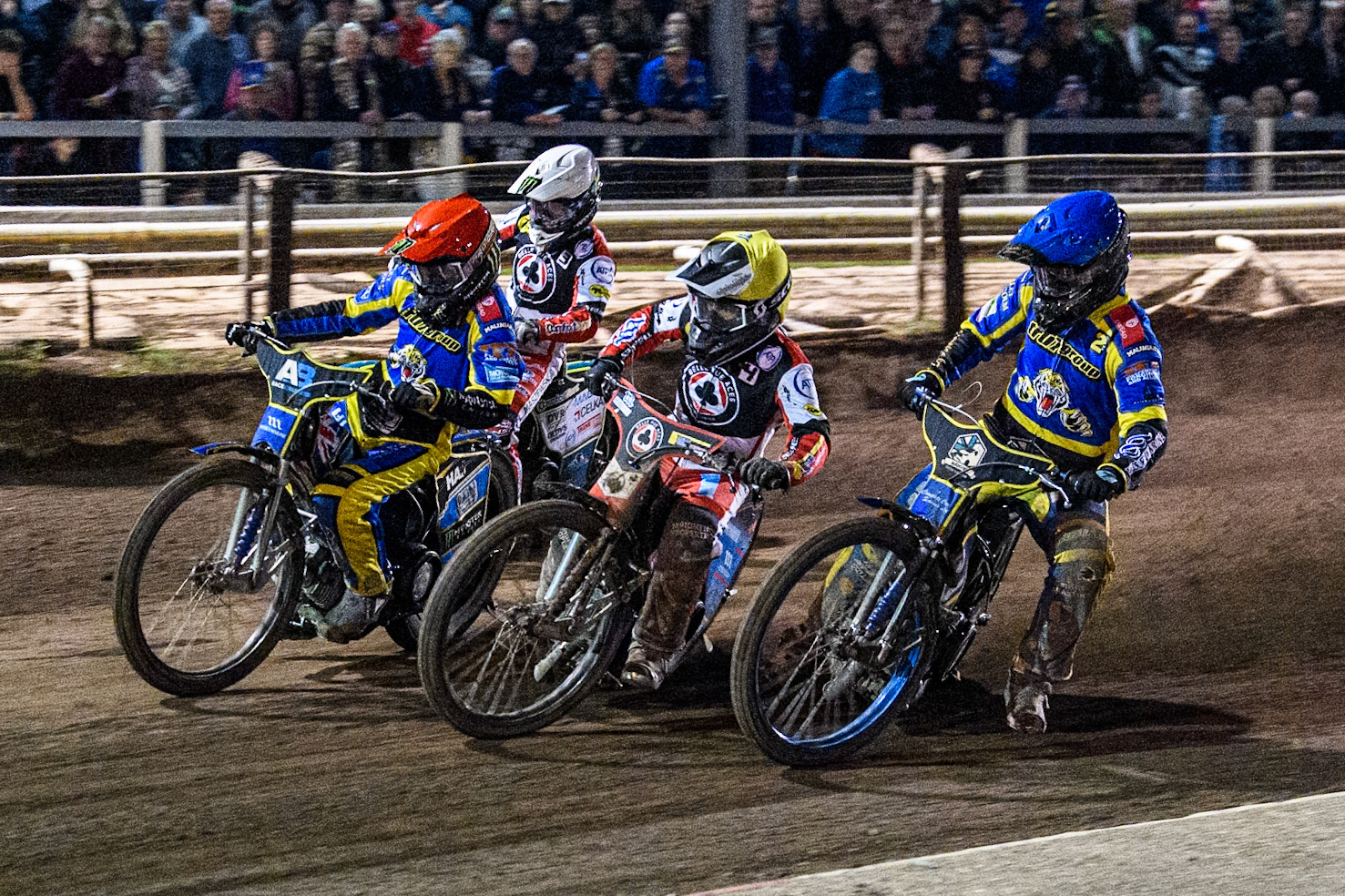 Sheffield Tigers' Jack Holder  in Red leading Belle Vue Aces' Ben Cook  in Yellow, Sheffield Tigers' Kyle Howarth  in Blue and Belle Vue Aces' Jaimon Lidsey  in White during the Rowe Motor Oil Premiership Play Off Semi Final 2nd leg between Sheffield Tigers and Belle Vue Aces at Owlerton Stadium, Sheffield on Thursday 19th September 2024. (Photo: Ian Charles | MI News)