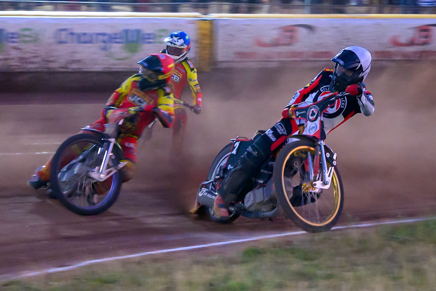 Norick Blodorn of Belle Vue Aces   in White rides inside Ryan Douglas of Leicester Lions in Red  and Sam Masters of Leicester Lions  in Blue during the Rowe Motor Oil Premiership match between Leicester Lions and Belle Vue Aces at the Hydroscan Arena, Leicester on Thursday 23rd July 2026. (Photo: Ian Charles | MI News)