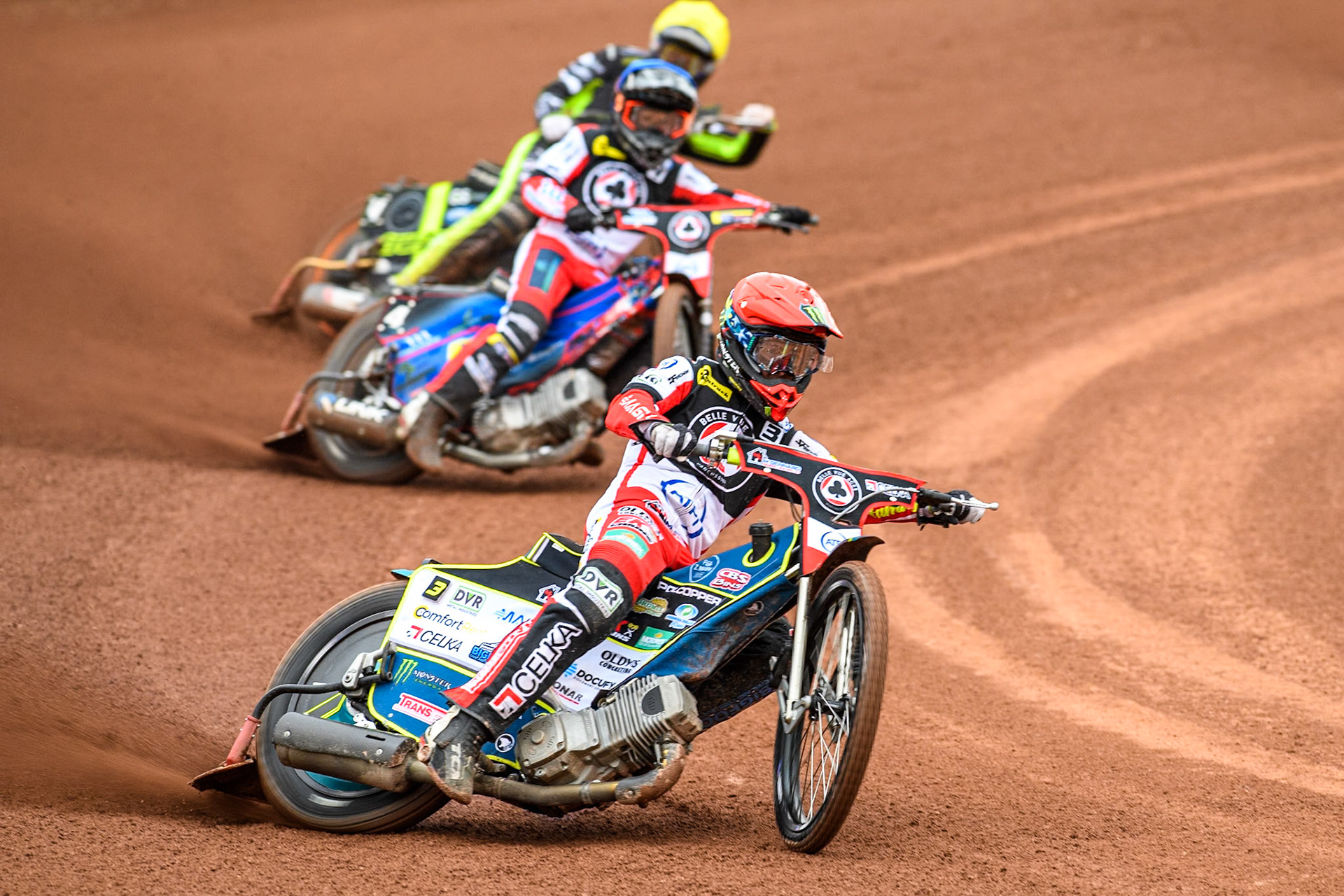 Belle Vue Aces' Jaimon Lidsey  in Red leading Belle Vue Aces' Ben Cook  in Blue and Ipswich Witches' Adam Ellis in Yellow during the Rowe Motor Oil Premiership match between Belle Vue Aces and Ipswich Witches at the National Speedway Stadium, Manchester on Monday 1st July 2024. (Photo: Ian Charles | MI News)