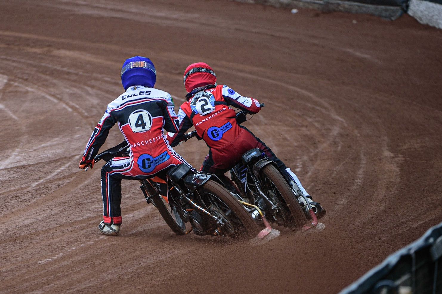 MANCHESTER, UK. APR 15TH Sam McGurk  (Red) passes his team mate Connor Coles  (Blue) during the National Development League match between Belle Vue Colts and Plymouth Centurions at the National Speedway Stadium, Manchester on Friday 15th April 2022. (Credit: Ian Charles | MI News)