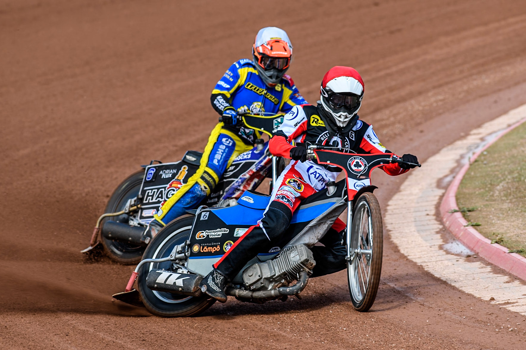 Belle Vue Aces' Antti Vuolas  in Red leading Sheffield Tigers' Jason Edwards  in White during the Rowe Motor Oil Premiership match between Belle Vue Aces and Sheffield Tigers at the National Speedway Stadium, Manchester on Monday 26th August 2024. (Photo: Ian Charles | MI News)