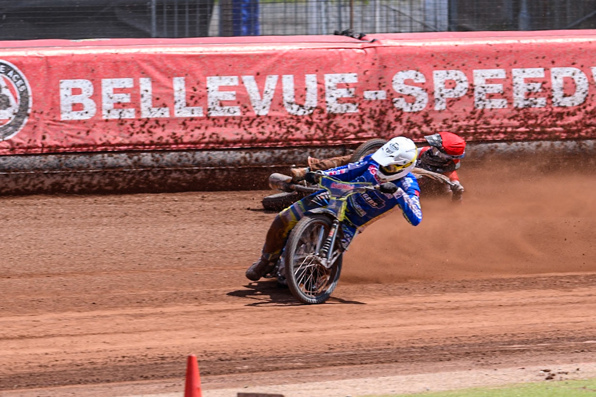Belle Vue Colts' Jack Kingston  in Red falls as Oxford Chargers' Jody Scott  in White passes him during the WSRA National Development League match between Belle Vue Colts and Oxford Chargers at the National Speedway Stadium, Manchester on Sunday 1st June 2025. (Photo: Ian Charles | MI News)