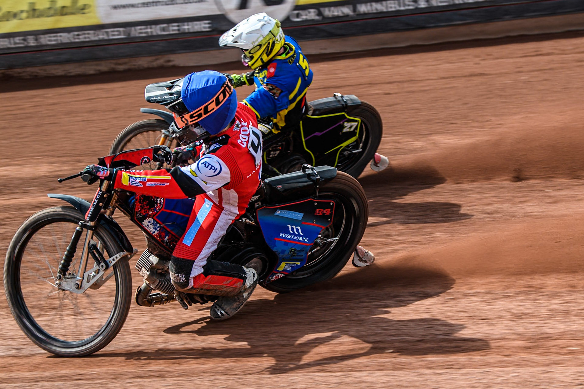 Belle Vue Aces' Ben Cook  in Blue rides inside Sheffield Tigers' Guest Rider Tom Brennan  in White during the Rowe Motor Oil Premiership match between Belle Vue Aces and Sheffield Tigers at the National Speedway Stadium, Manchester on Monday 26th August 2024. (Photo: Ian Charles | MI News)