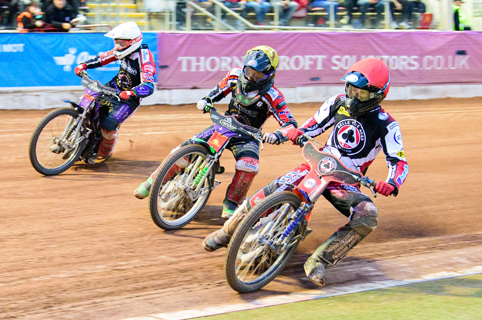Brady Kurtz (Red) inside Ulrich Oostergaard  (White) and Benjamin Basso  (Yellow) during the SGB Premiership match between Belle Vue Aces and Peterborough at the National Speedway Stadium, Manchester on Monday 25th July 2022. (Credit: Ian Charles | MI News