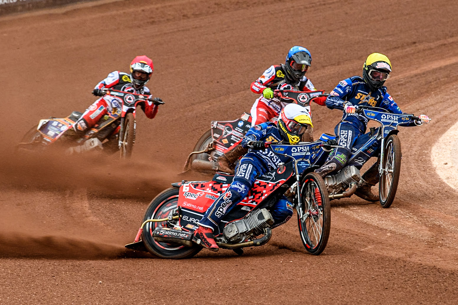 King Lynn Stars' Patryk Wojdylo in White and King Lynn Stars' Anders Rowe in Yellow leading Belle Vue Aces' Connor Bailey in Blue and Belle Vue Aces' Connor Mountain in Red during the Rowe Motor Oil Premiership match between Belle Vue Aces and King's Lynn Stars at the National Speedway Stadium, Manchester on Monday 20th May 2024. (Photo: Ian Charles | MI News)