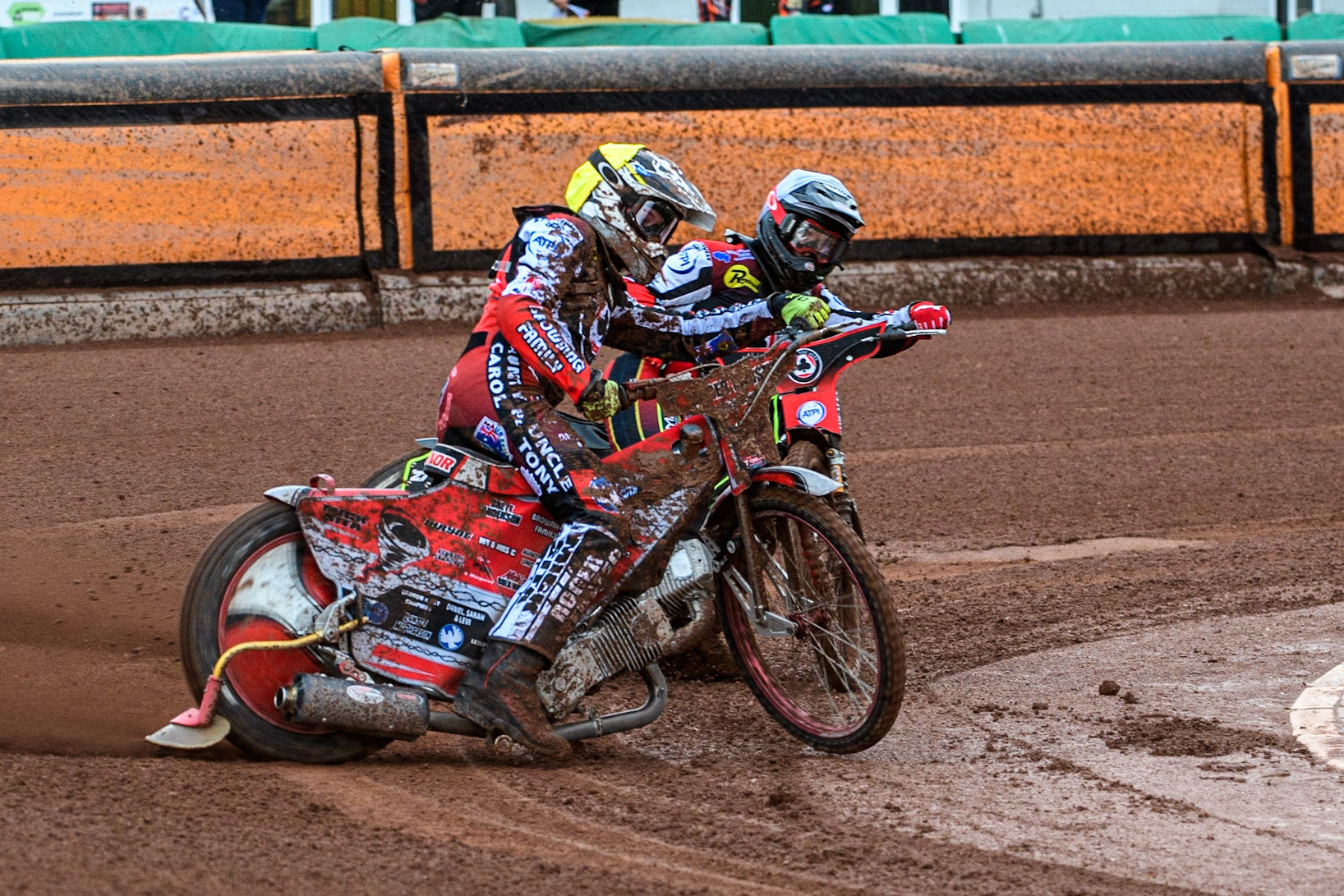 Connor Bailey (Yellow) locks up and falls ahead of team mate Tom Brennan (White) during the Sports Insure Premiership match between Wolverhampton Wolves and Belle Vue Aces at Monmore Green Stadium, Wolverhampton on Monday 10th July 2023. (Photo: Ian Charles | MI News)