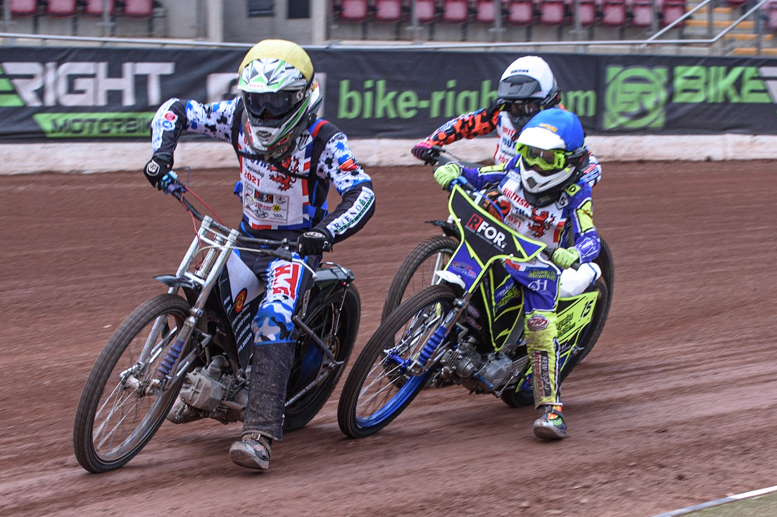 MANCHESTER, UK. AUGUST 2OTH   Billy Budd (Yellow) leads as Cooper Rushen  (White) and Oliver Bovingdon  (Blue) get close to each other with Rico Joyce  (Red) behindat the National Speedway Stadium, Manchester on Friday 20th August 2021. (Credit: Ian Charles | MI News)