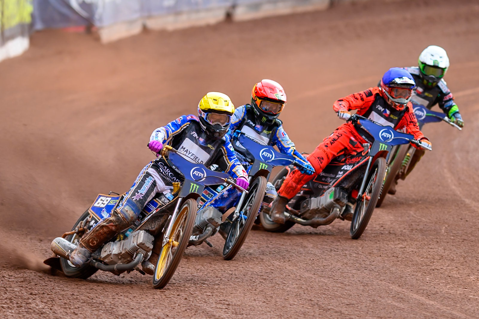 Jason Doyle (69) of Australia in Yellow rides outside Jack Holder (25) of Australia in Red, Jan Kvech (201) of Czech Republic in Blue and Patryk Dudek (692) of Poland in White during the ATPI  FIM Speedway GP of Manchester at the National Speedway Stadium, Manchester on Saturday 6th June 2026. (Photo: Ian Charles | MI News)