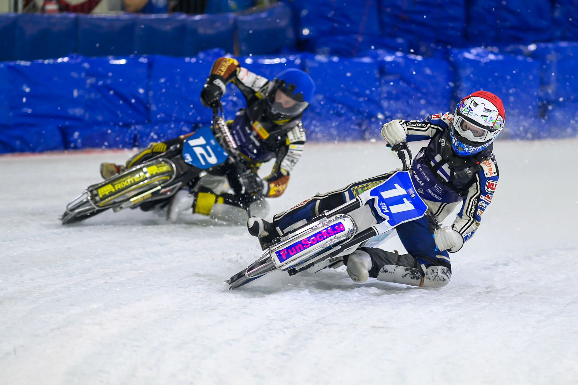 Max Koivula (11) of Finland  in Red leading Heikki Huusko (12) of Finland  in Blue during the FIM Ice Speedway Of Nations at Ice Rink Thialf, Heerenveen on Sunday 12th April 2026. (Photo: Ian Charles | MI News)
