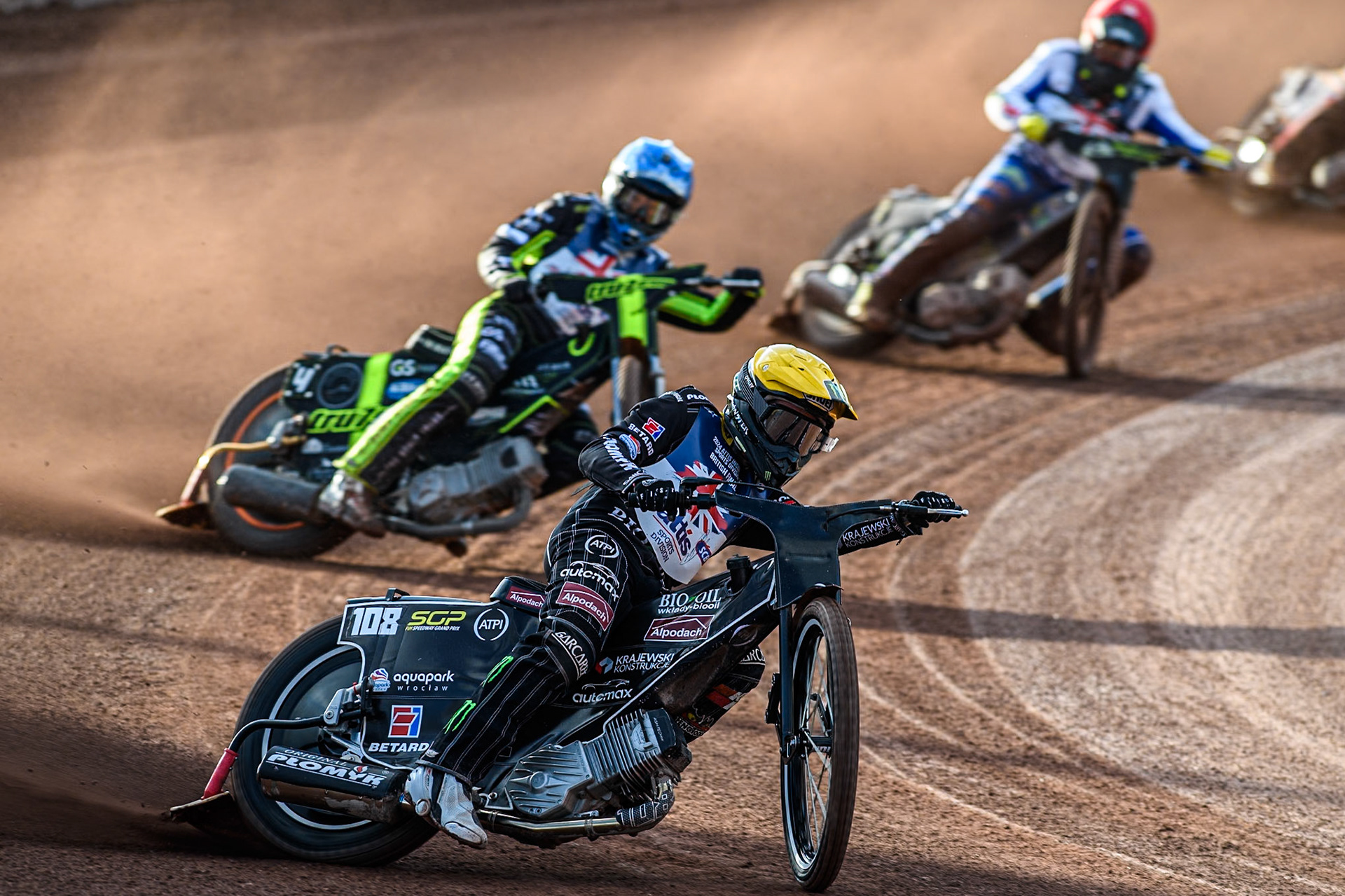 Tai Woffinden in Yellow leading Adam Ellis in Blue and Craig Cook in Red during the Attis Insurance Sports Division British Speedway Championship Final at the National Speedway Stadium, Manchester on Saturday 8th June 2024. (Photo: Ian Charles | MI News)