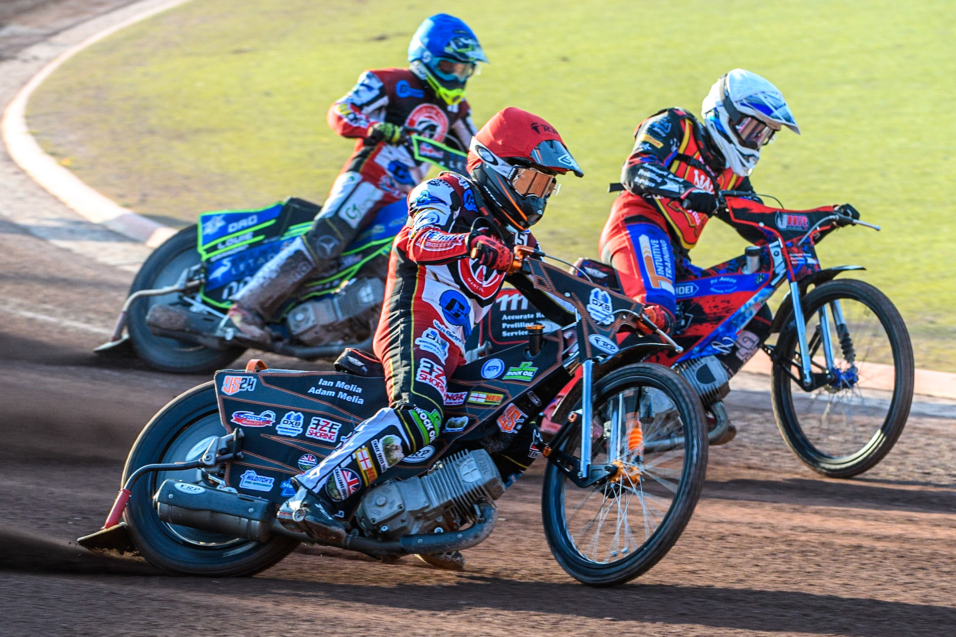 Jack Smith (Red) outside Jacob Hook (White) with Luke Muff (Blue) behind during the National Development League match between Belle Vue Colts and Kent Royals at the National Speedway Stadium, Manchester on Friday 7th July 2023. (Photo: Ian Charles | MI News)