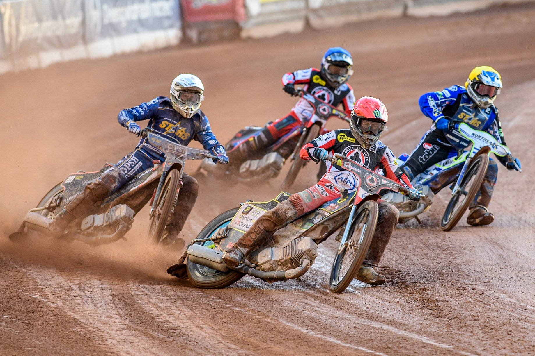Belle Vue Aces' Jaimon Lidsey  in Red leading Kings Lynn Stars' Jan Kvech  in White , Kings Lynn Stars' Guest Rider Chris Harris  in Yellow and Belle Vue Aces' Ben Cook  in Blue during the Rowe Motor Oil Premiership match between Belle Vue Aces and King's Lynn Stars at the National Speedway Stadium, Manchester on Monday 12th August 2024. (Photo: Ian Charles | MI News)