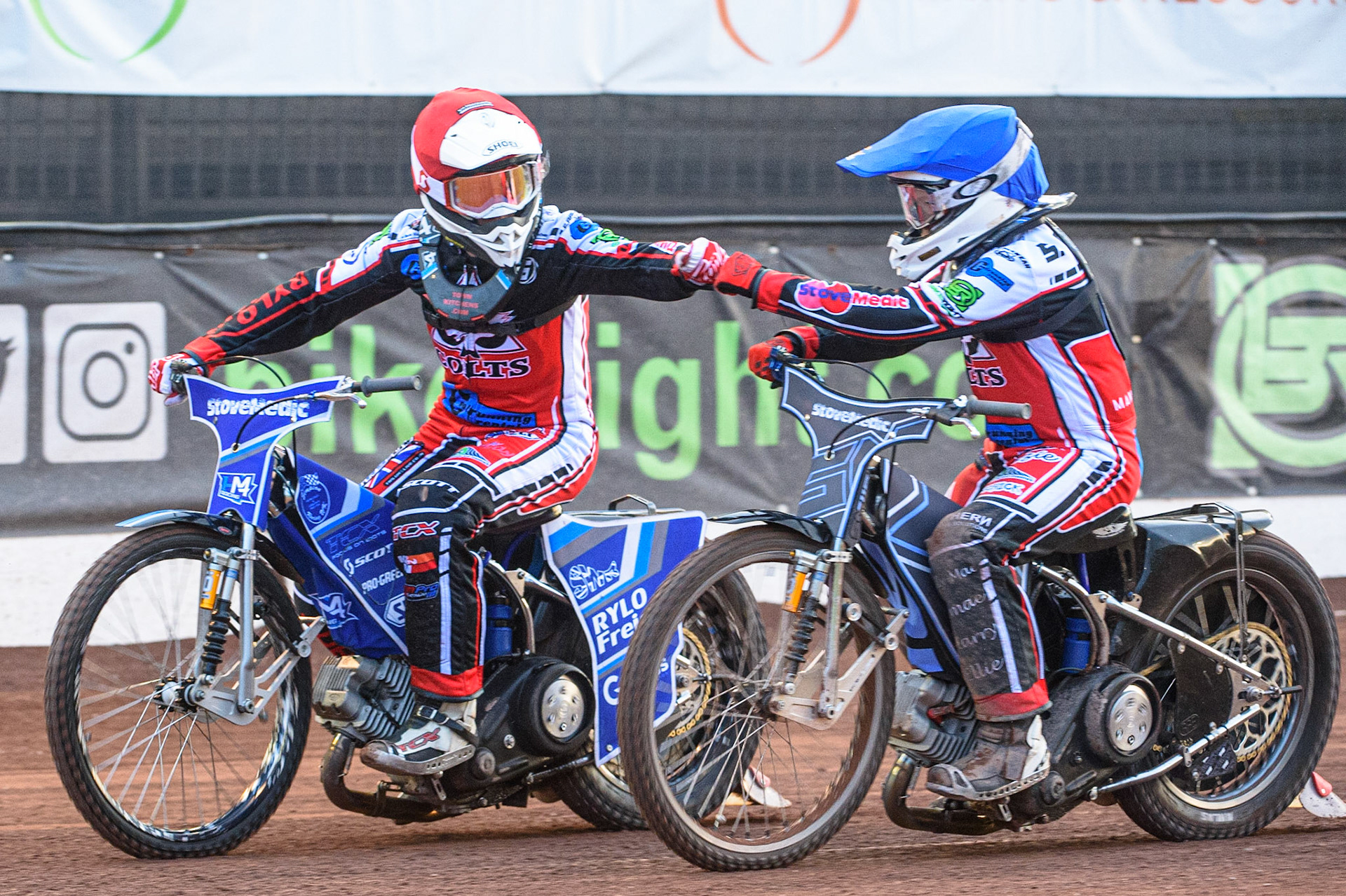 MANCHESTER, UK. MAY 28TH  Harry McGurk (Red)  and Sam McGurk (Blue) celebrate their 5-1 heat win during the SGB National Development League match between Belle Vue Colts and Berwick Bullets at the National Speedway Stadium, Manchester on Friday 28th May 2021. (Credit: Ian Charles | MI News)