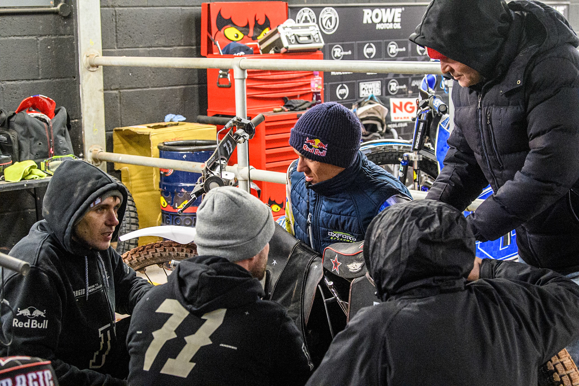 Maciej Janowski (Centre) discusses tactics with his team during the Peter Craven Memorial Trophy at the National Speedway Stadium, Manchester on Monday 17th March 2025. (Photo: Ian Charles | MI News)