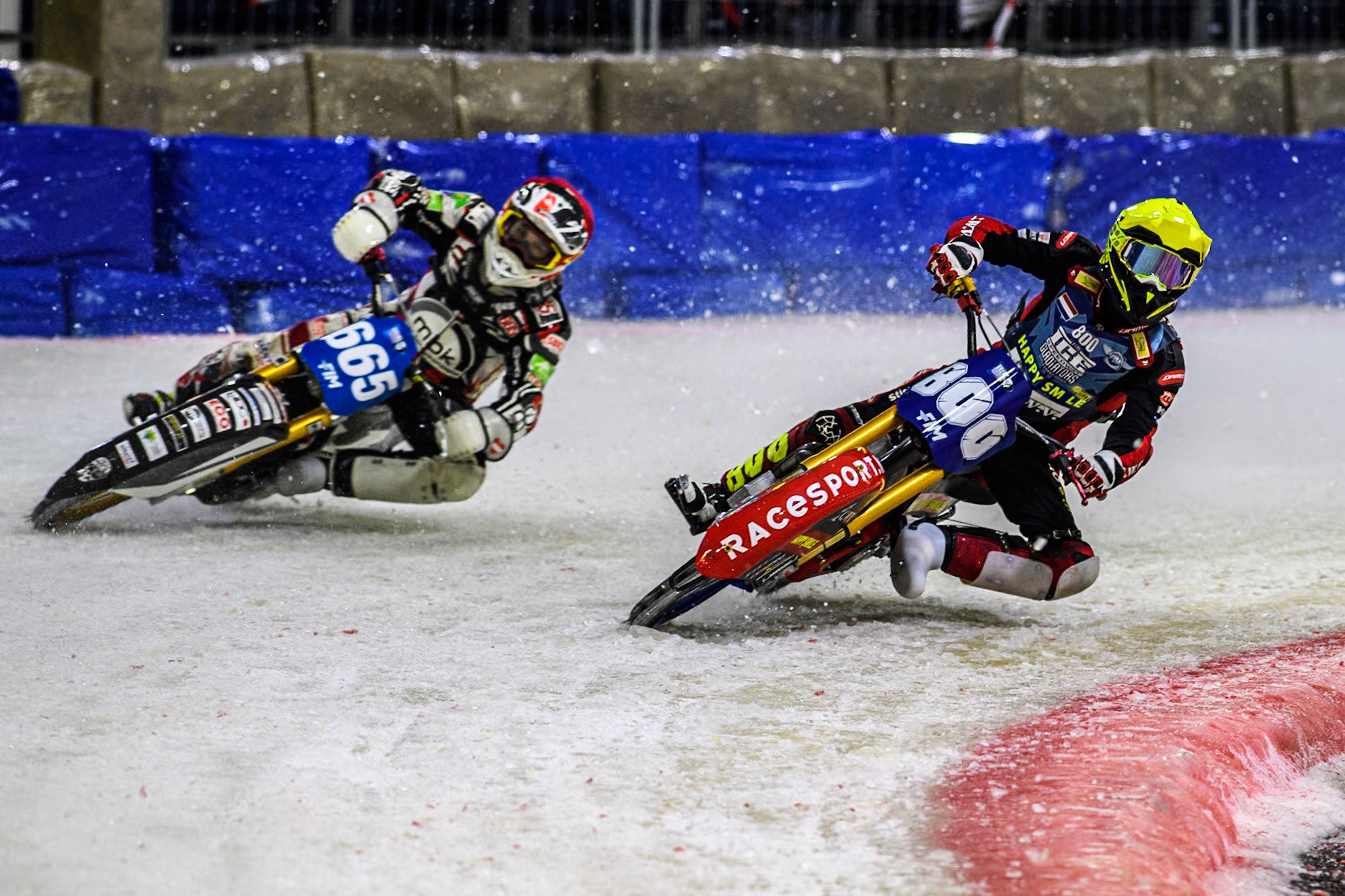 Netherlands' Jasper Iwema (800) in Yellow rides inside Austria's Charly Ebner (665) in Red during the FIM Ice Speedway Gladiators World Championship Final 3 at Ice Rink Thialf, Heerenveen on Saturday 6th April 2024. (Photo: Ian Charles | MI News)