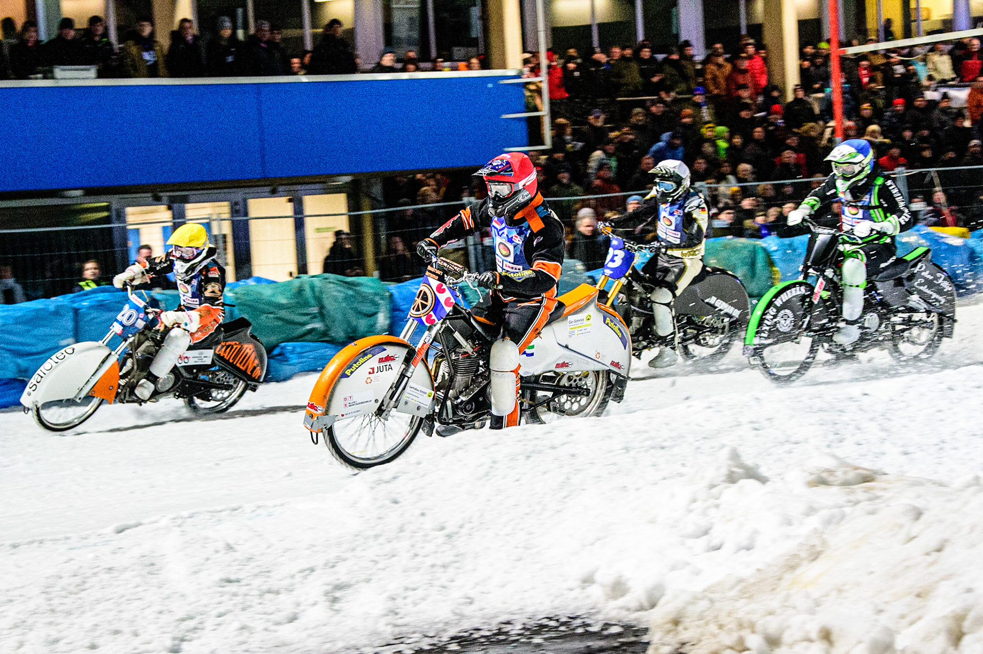 Sebastian Reitsma (Red) inside Artturi Ervasti (Yellow) with Finn Loheider (Blue) and Franz Mayerbüchler (White) behind during the German Individual Ice Speedway Championship at Horst-Dohm-Eisstadion, Berlin on Friday 3rd March 2023. (Photo: Ian Charles | MI News)