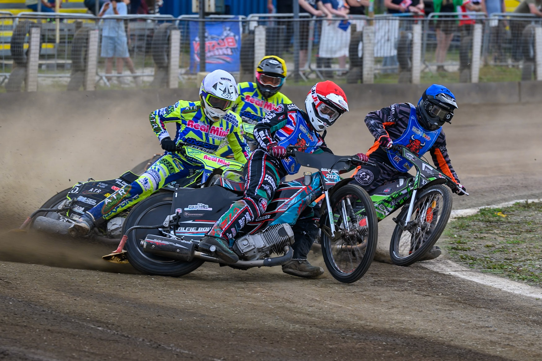 Alfie Bowtell of Buxton Bulls in Red  and Jack Roberts of Buxton Bulls in Blue  leading  Darryl Ritchings of Oxford Chargers in White and Ashton Vale of Oxford Chargers in Yellow during the WSRA National Development League match between Buxton Bulls and Oxford Chargers at Hi-Edge Speedway, Buxton on Sunday 2nd August 2026. (Photo: Ian Charles | MI News)