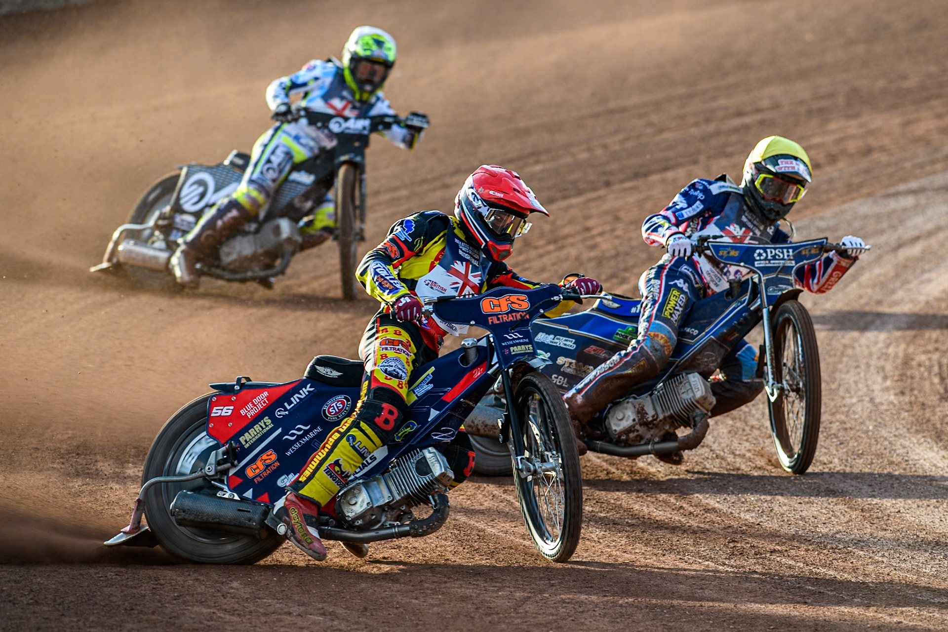 Steve Worrall in Red leading Anders Rowe in Yellow and Lewis Kerr in White during the Attis Insurance Sports Division British Speedway Championship Final at the National Speedway Stadium, Manchester on Saturday 8th June 2024. (Photo: Ian Charles | MI News)