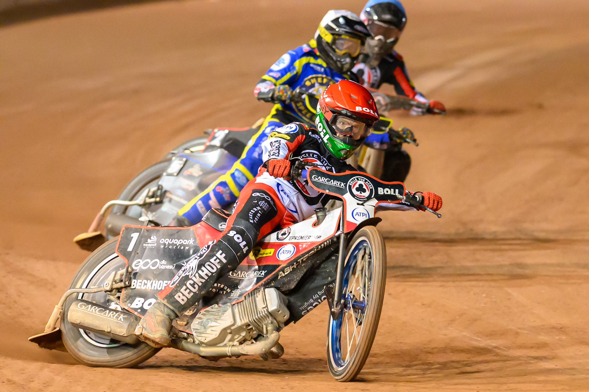 Brady Kurtz of Belle Vue Aces in Red leading Josh Pickering of Sheffield Tigers in White and Norick Blödorn of Belle Vue Aces in Blue during the Rowe Motor Oil Premiership match between Belle Vue Aces and Sheffield Tigers at the National Speedway Stadium, Manchester on Monday 14th September 2026. (Photo: Ian Charles | MI News)