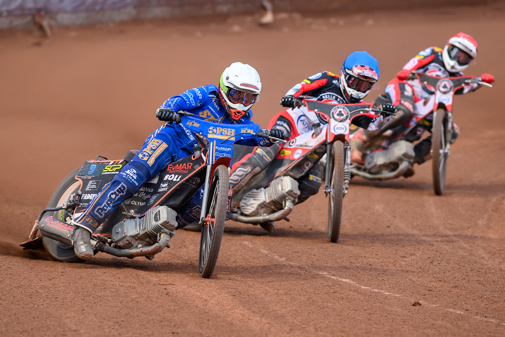 Jan Kvech of Kings Lynn Stars in White leading Zach Cook of Belle Vue Aces in Blue and Peter Kildemand of Belle Vue Aces in Red during the Rowe Motor Oil Premiership match between Belle Vue Aces and King's Lynn Stars at the National Speedway Stadium, Manchester on Monday 29th June 2026. (Photo: Ian Charles | MI News)
