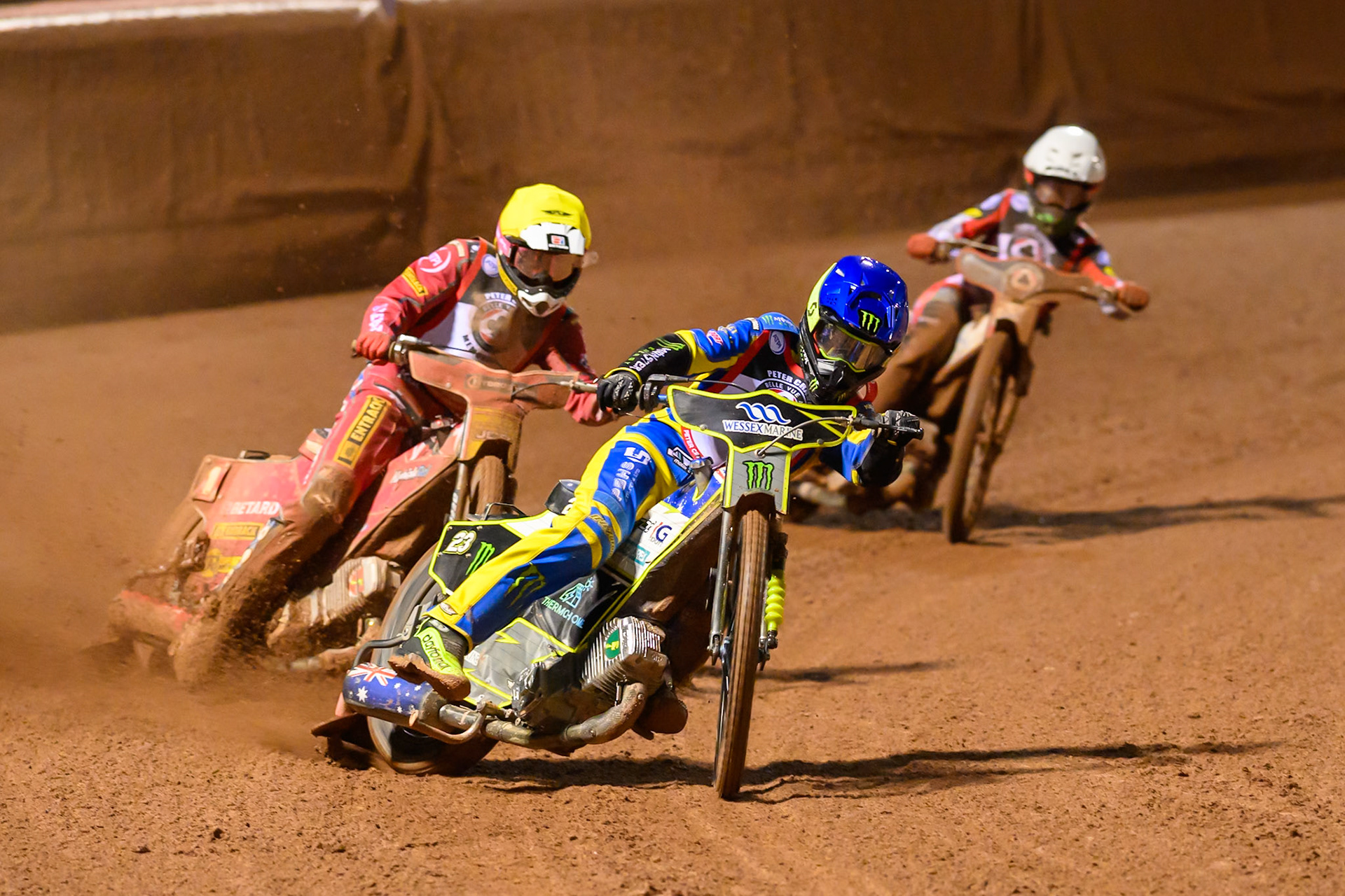 Chris Holder  in Blue leading Max Fricke in Yellow and Brady Kurtz  in White during the Peter Craven Memorial Trophy at the National Speedway Stadium, Manchester, on Monday 16th March 2026. (Photo: Ian Charles | MI News)