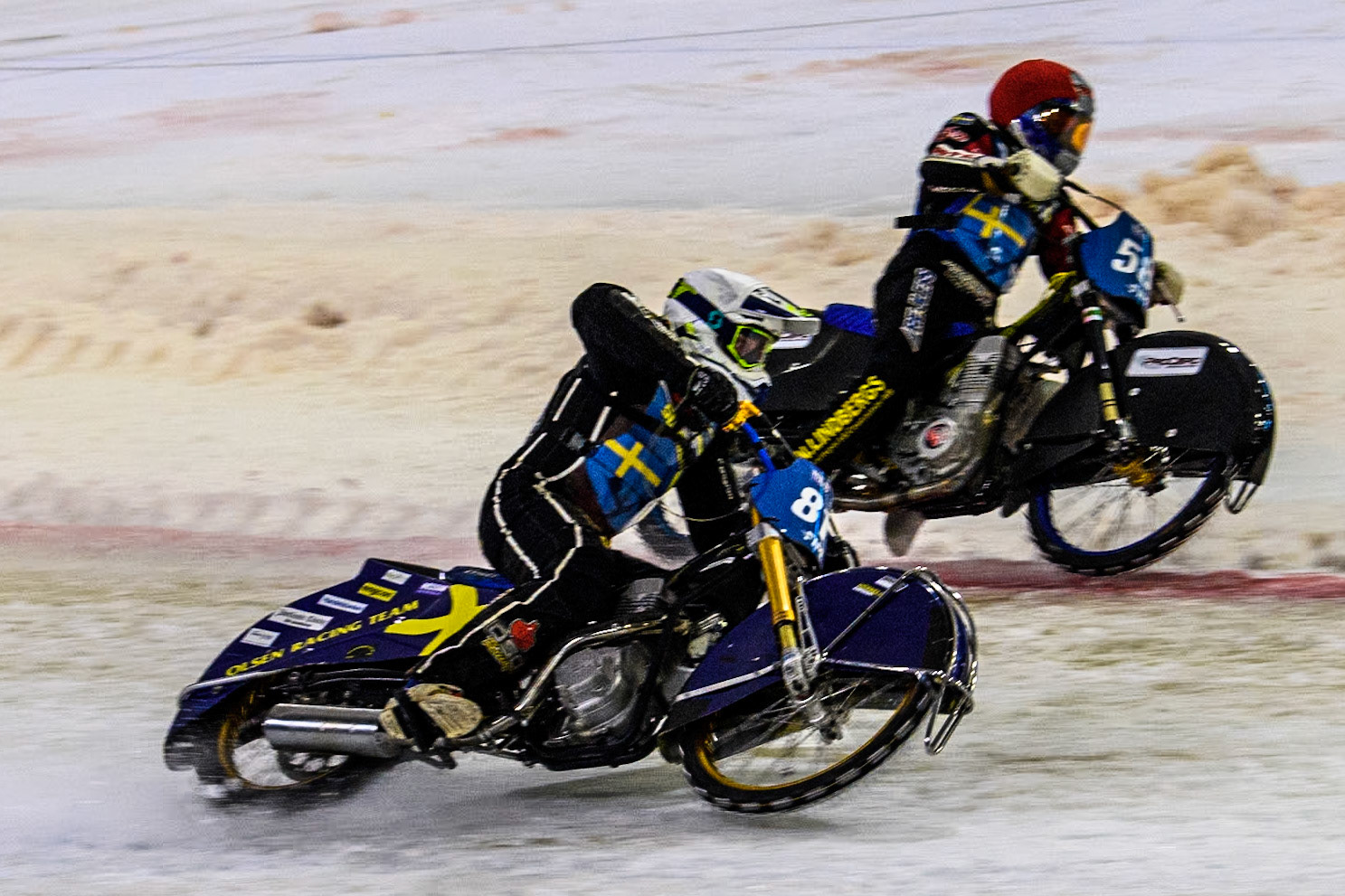 The Final: Sweden"s Jimmy Olsén (81) in White rides outside Sweden's Stefan Svensson (58) in Red during the FIM Ice Speedway Gladiators World Championship Final 4 at Ice Rink Thialf, Heerenveen on Sunday 7th April 2024. (Photo: Ian Charles | MI News)