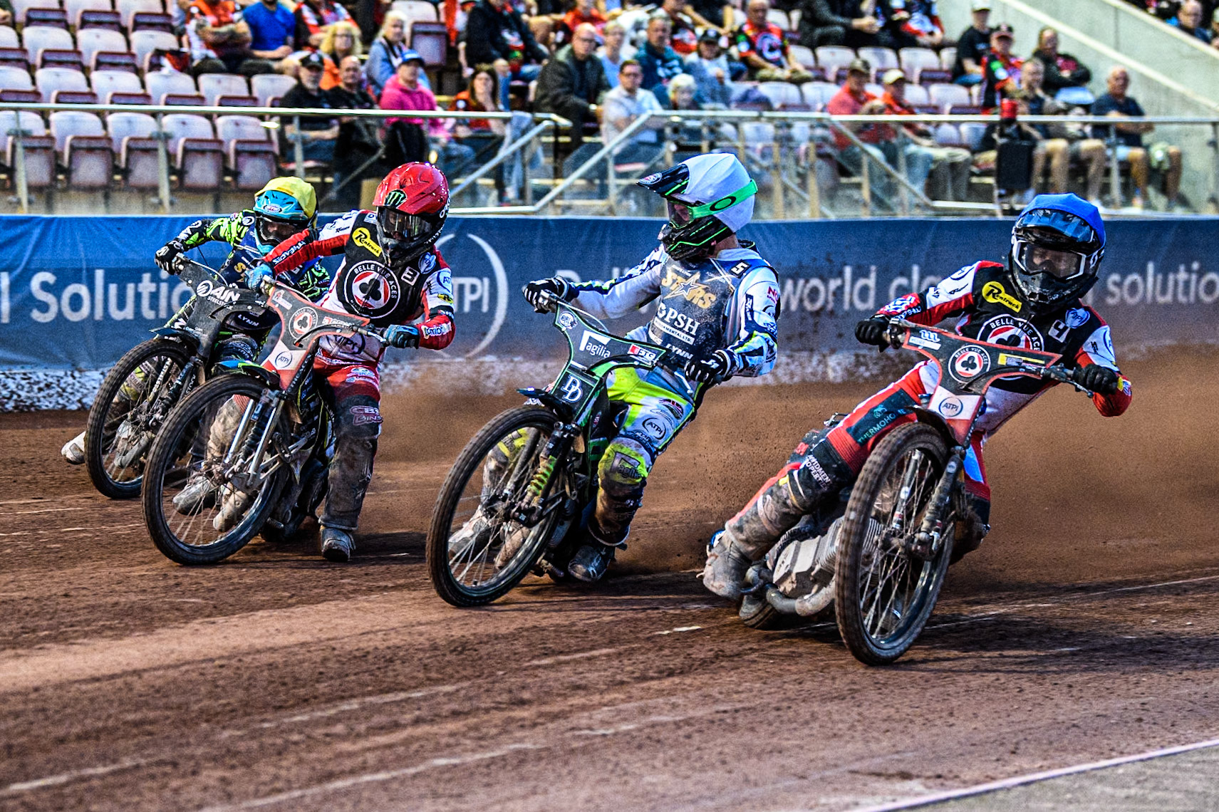 Belle Vue Aces' Ben Cook in Blue rides inside \Kings Lynn Stars' Guest Rider Charles Wright  in White, Belle Vue Aces' Jaimon Lidsey  in Red and Kings Lynn Stars' Lewis Kerr in Yellow during the Rowe Motor Oil Premiership match between Belle Vue Aces and King's Lynn Stars at the National Speedway Stadium, Manchester on Monday 12th August 2024. (Photo: Ian Charles | MI News)