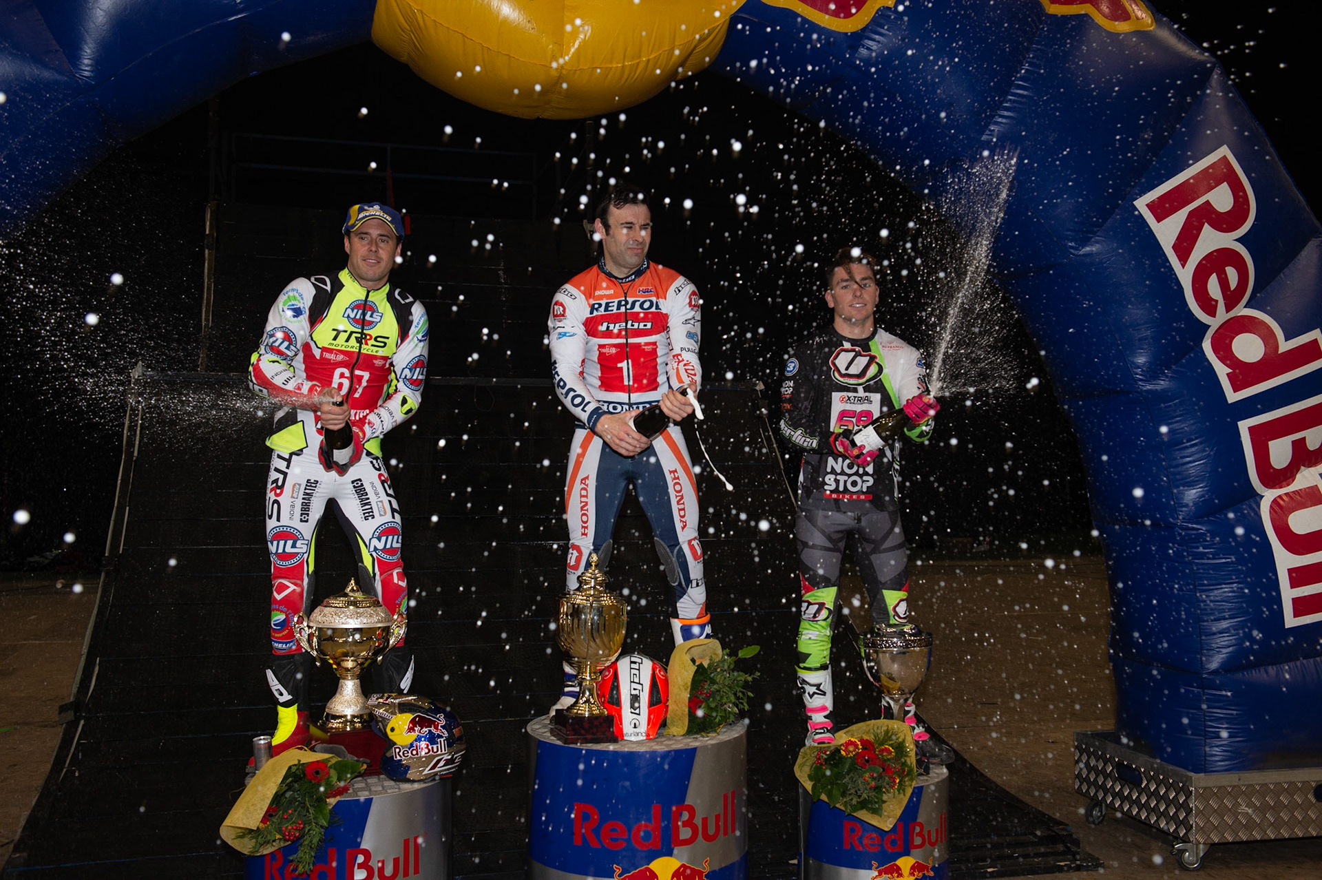 SHEFFIELD, ENGLAND  - DECEMBER 28TH  Top 3 - (l-r) Adam Raga (2nd), Tony Bou (Winner) Jamie Busto (3rd) spray the Champagne during the 25th Anniversary Sheffield Indoor Trial at the FlyDSA Arena, Sheffield on Saturday 28th December 2019. (Credit: Ian Charles | MI News)