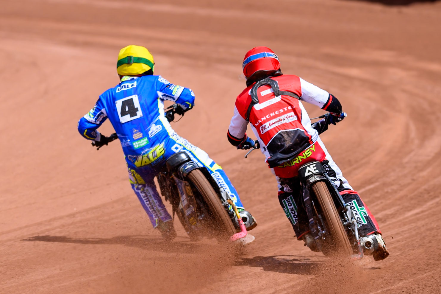Belle Vue Colts' Jack Kingston  in Red rides outside Oxford Chargers' Ashton Vale  in Yellow during the WSRA National Development League match between Belle Vue Colts and Oxford Chargers at the National Speedway Stadium, Manchester on Sunday 1st June 2025. (Photo: Ian Charles | MI News)