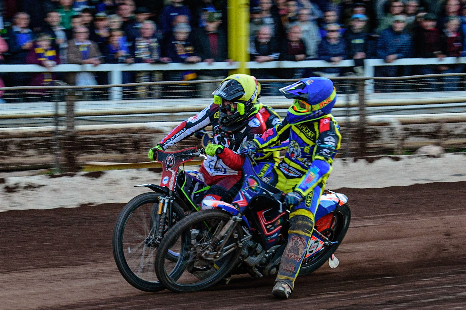 SHEFFIELD, UK. MAY 26TH  Stefan Nielsen  loses control and collides with Tom Brennan  (Yellow) with Kyle Howarth  (Red) on the outside during the SGB Premiership match between Sheffield Tigers and Belle Vue Aces at Owlerton Stadium, Sheffield on Thursday 26th May 2022. (Credit: Ian Charles | MI News)