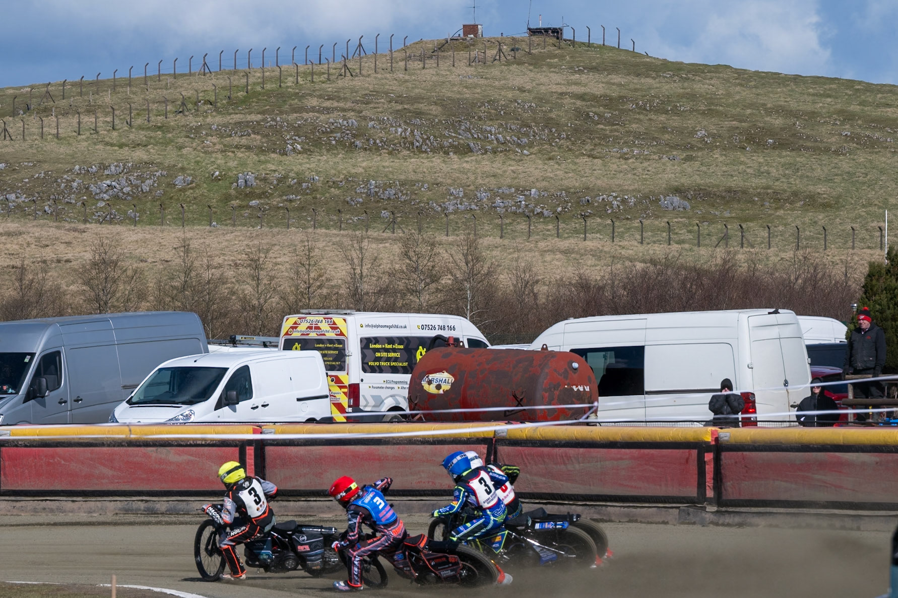 Riders hit the first turn in front of the peaks during the Regina Chains Fours at Buxton Speedway, Buxton on Sunday 5th April 2026. (Photo: Ian Charles | MI News)