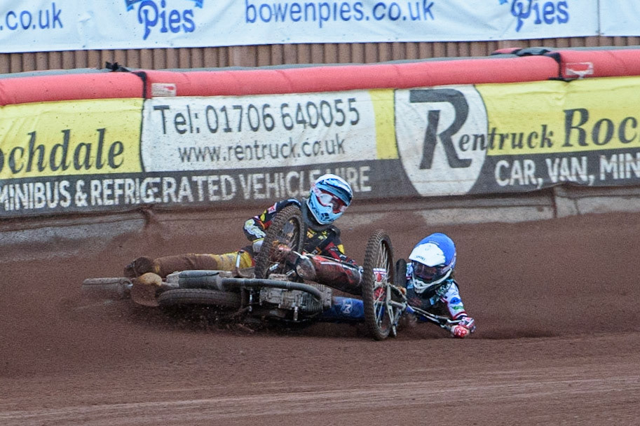 MANCHESTER, UK. JULY 29TH   Harry McGurk (Blue) picks up some drive and falls during the National Development League match between Belle Vue Colts and Leicester Lion Cubs at the National Speedway Stadium, Manchester on Thursday 29th July 2021. (Credit: Ian Charles | MI News)