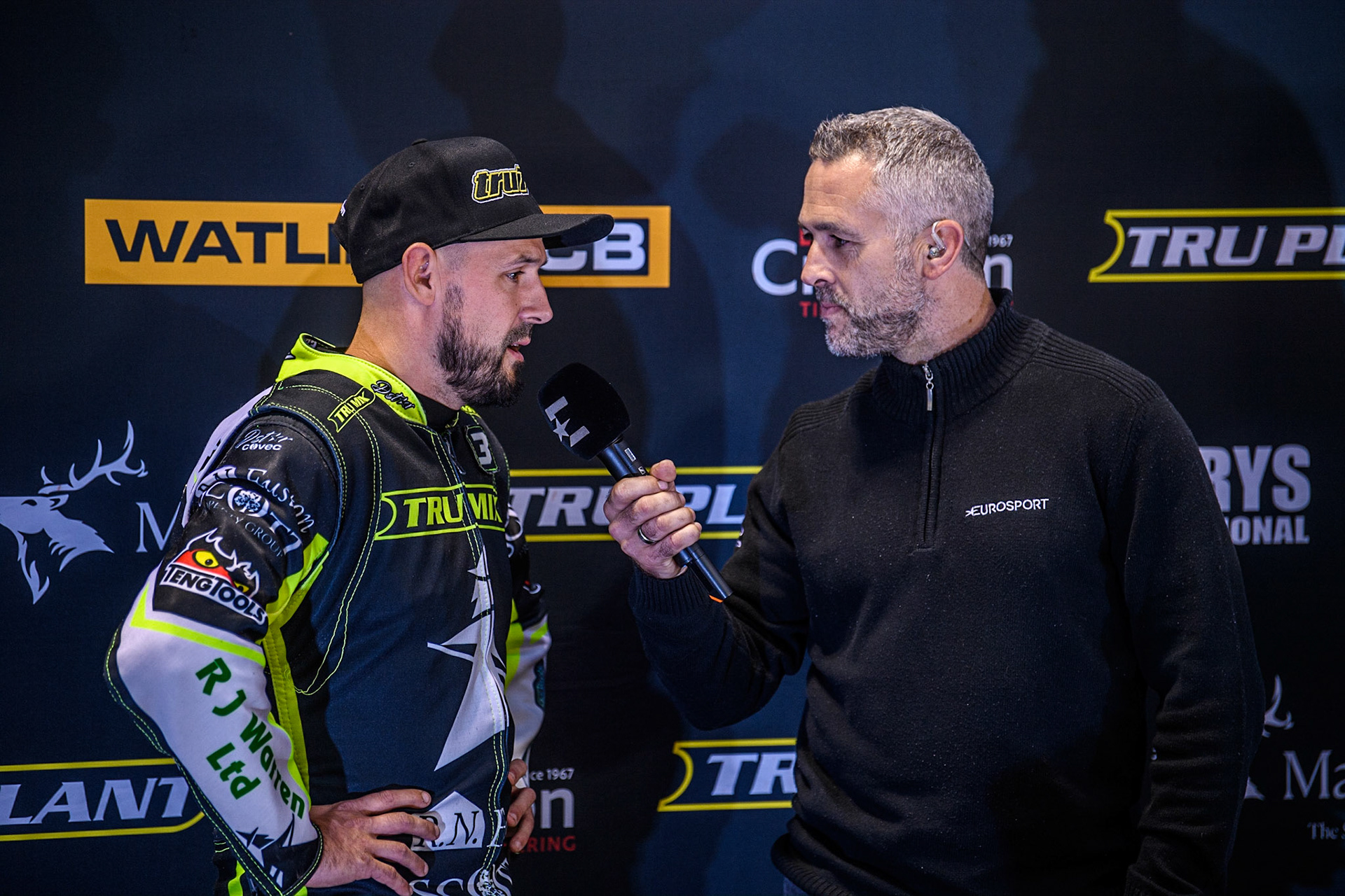 Danny King (Left) is interviewed by Scott Nicholls for the Eurosport Cameras during the Sports Insure Premiership Semi Final Playoff 2nd leg match between Belle Vue Aces and Ipswich Witches at the National Speedway Stadium, Manchester on Monday 25th September 2023. (Photo: Ian Charles | MI News)