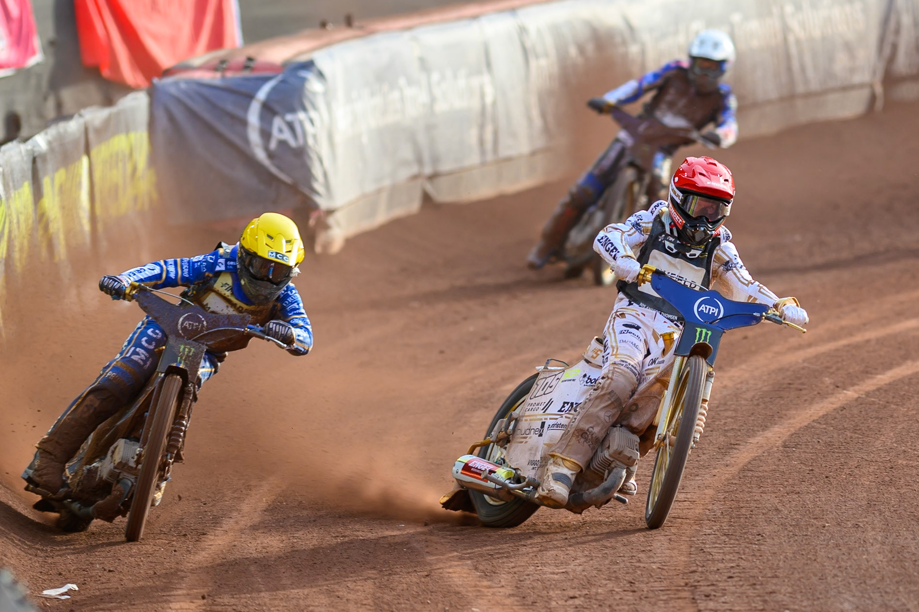 Bartosz Zmarzlik (95) of Poland in Yellow rides outside Anders Thomsen (105) of Denmark in Red with Bartosz Zmarzlik (95) of Poland in White behind during the ATPI  FIM Speedway GP of Manchester at the National Speedway Stadium, Manchester on Friday 5th June 2026. (Photo: Ian Charles | MI News)