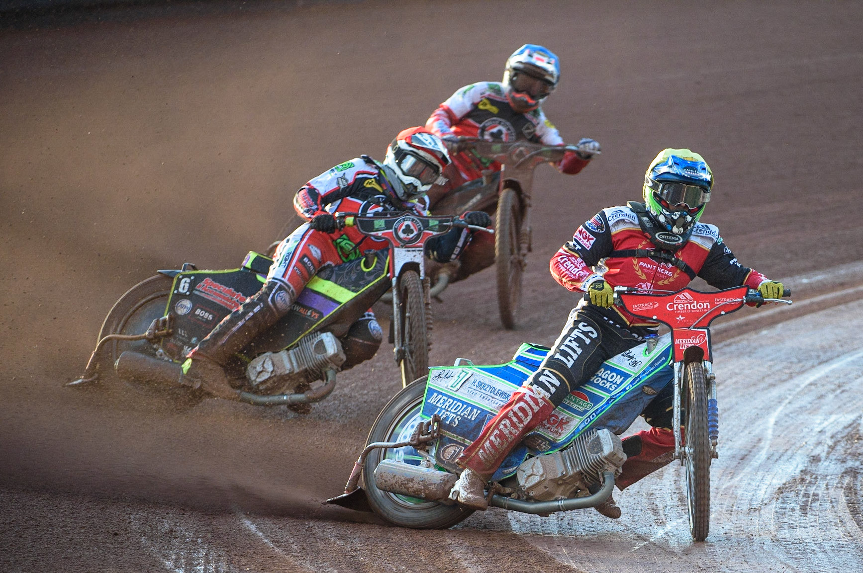 MANCHESTER, UK. AUG 9TH  Hans Andersen  (Yellow) leads Tom Brennan  (Red) and Ricky Wells  (Blue) during the SGB Premiership match between Belle Vue Aces and Peterborough at the National Speedway Stadium, Manchester on Monday 9th August 2021. (Credit: Ian Charles | MI News)