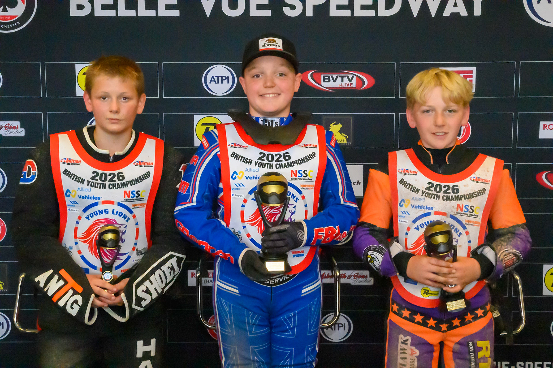 125cc SUPPORT CLASS TOP 3: (L to R)  Jenson Braithwaite (16) (3rd), Aston Knott (89) (Winner), George Climo (83) (2nd) during the British Youth Championship (125cc) at the National Speedway Stadium, Manchester on Sunday 19th July 2026. (Photo: Ian Charles | MI News)