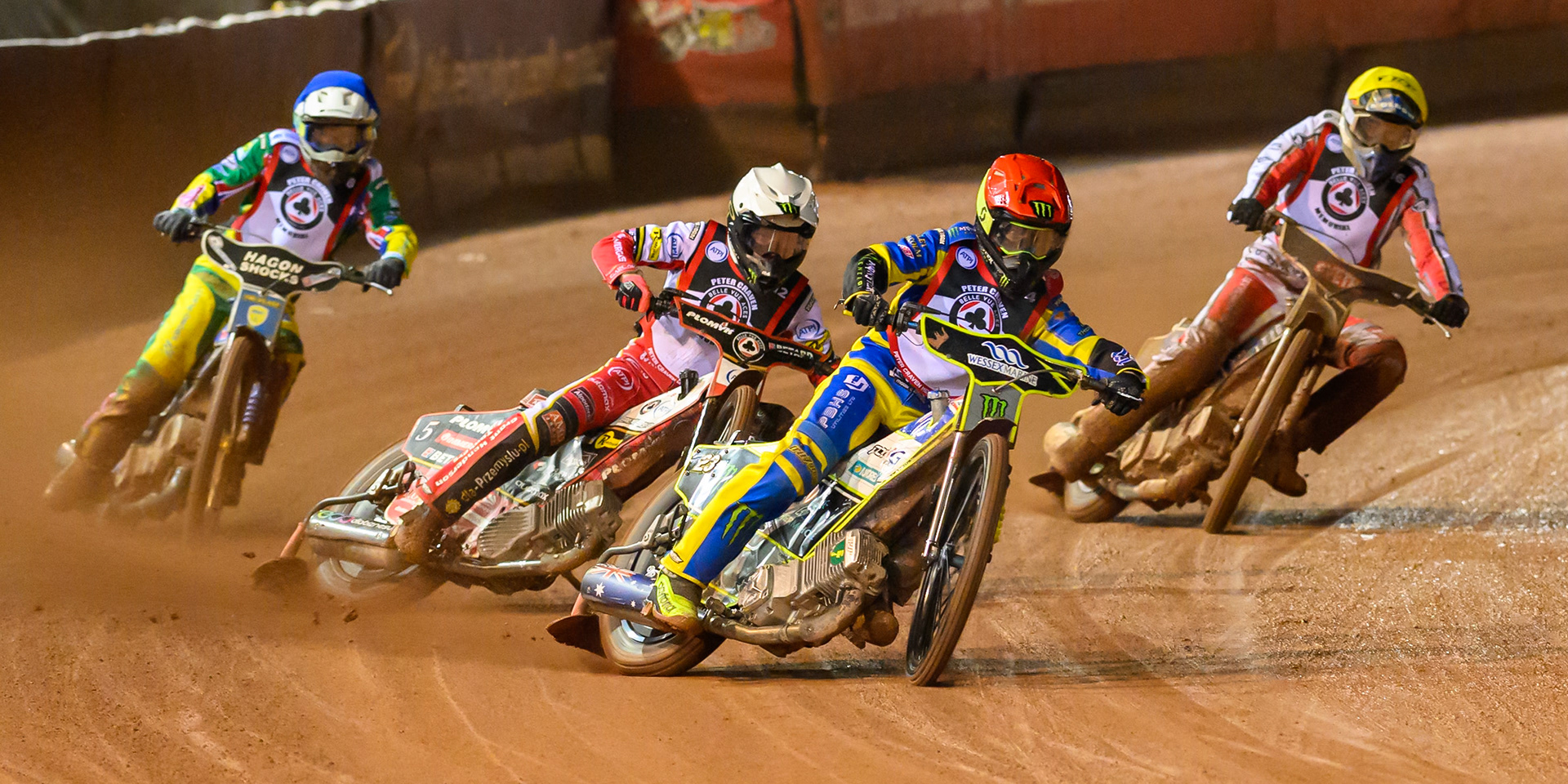 Chris Holder  in Red leading Dan Bewley in White, Jason Doyle  in Blue and Rasmus Jensen in Yellow during the Peter Craven Memorial Trophy at the National Speedway Stadium, Manchester, on Monday 16th March 2026. (Photo: Ian Charles | MI News)