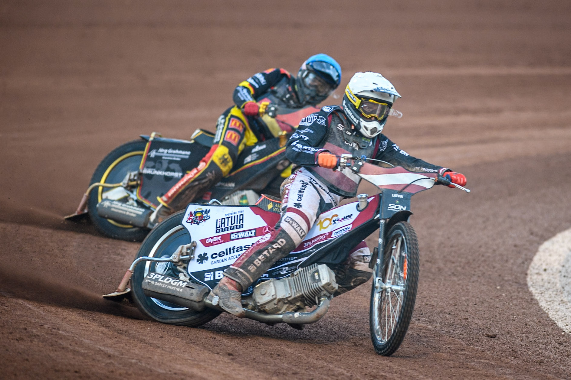 Andzejs Lebedevs of Latvia in White leading Norick Blödorn of Germany in Blue during the Monster Energy FIM Speedway of Nation Final at the National Speedway Stadium, Manchester on Saturday 13th July 2024. (Photo: Ian Charles | MI News)