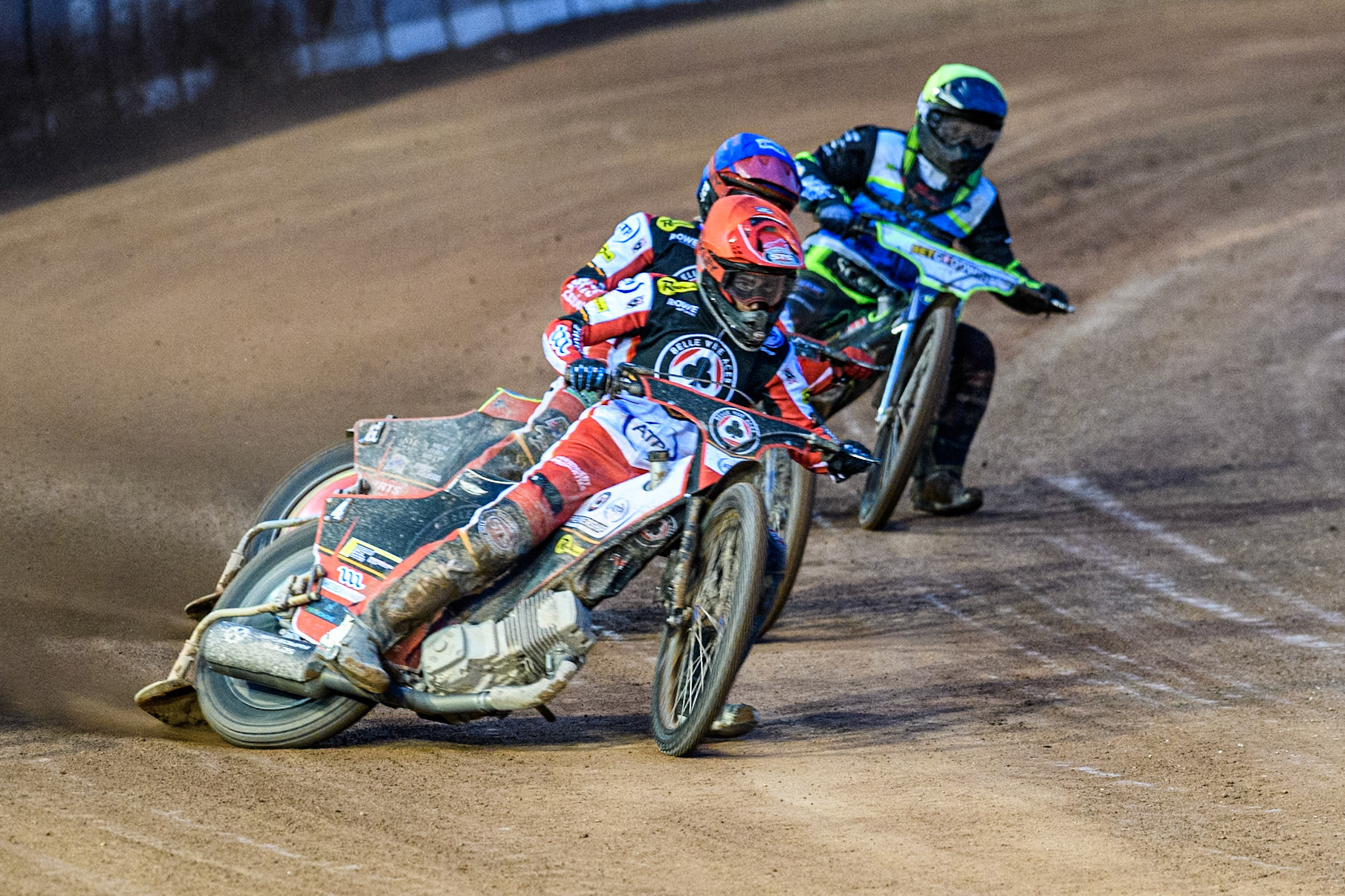 Belle Vue Aces' Zack Cook in Red leading Belle Vue Aces' Tate Zischke in Blue and Oxford Spires' Guest Rider Dan Thompson in Yellow during the Rowe Motor Oil Premiership match between Belle Vue Aces and Oxford Spires at the National Speedway Stadium, Manchester on Monday 14th April 2025. (Photo: Ian Charles | MI News)