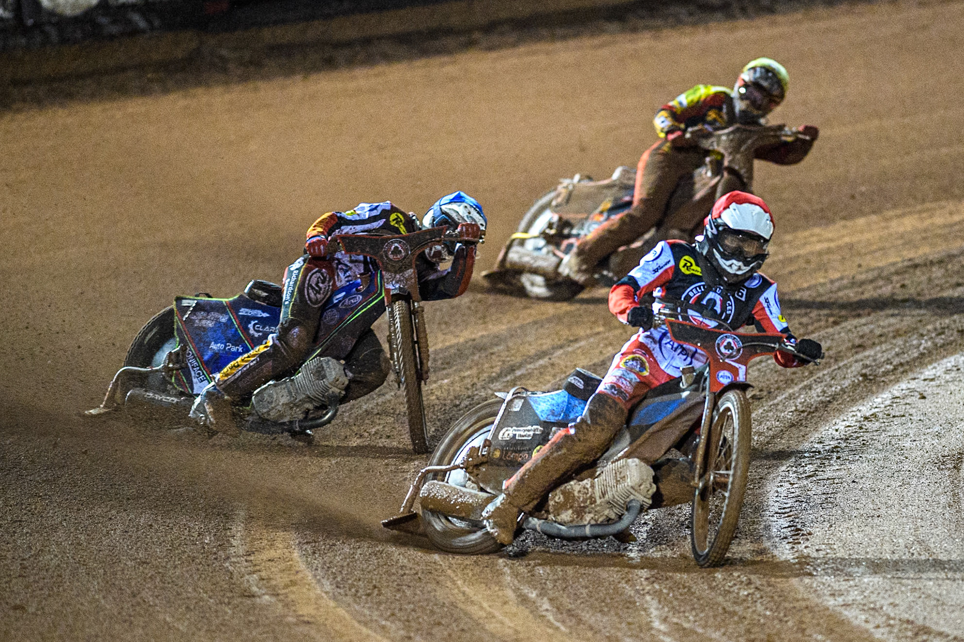 Belle Vue Aces' Antti Vuolas in Red leading Belle Vue Aces' Jake Mulford  in Blue and Leicester Lions' Sam Hagon  in Yellow during the Rowe Motor Oil Premiership Grand Final 1st Leg between Belle Vue Aces and Leicester Lions at the National Speedway Stadium, Manchester on Monday 23rd September 2024. (Photo: Ian Charles | MI News)