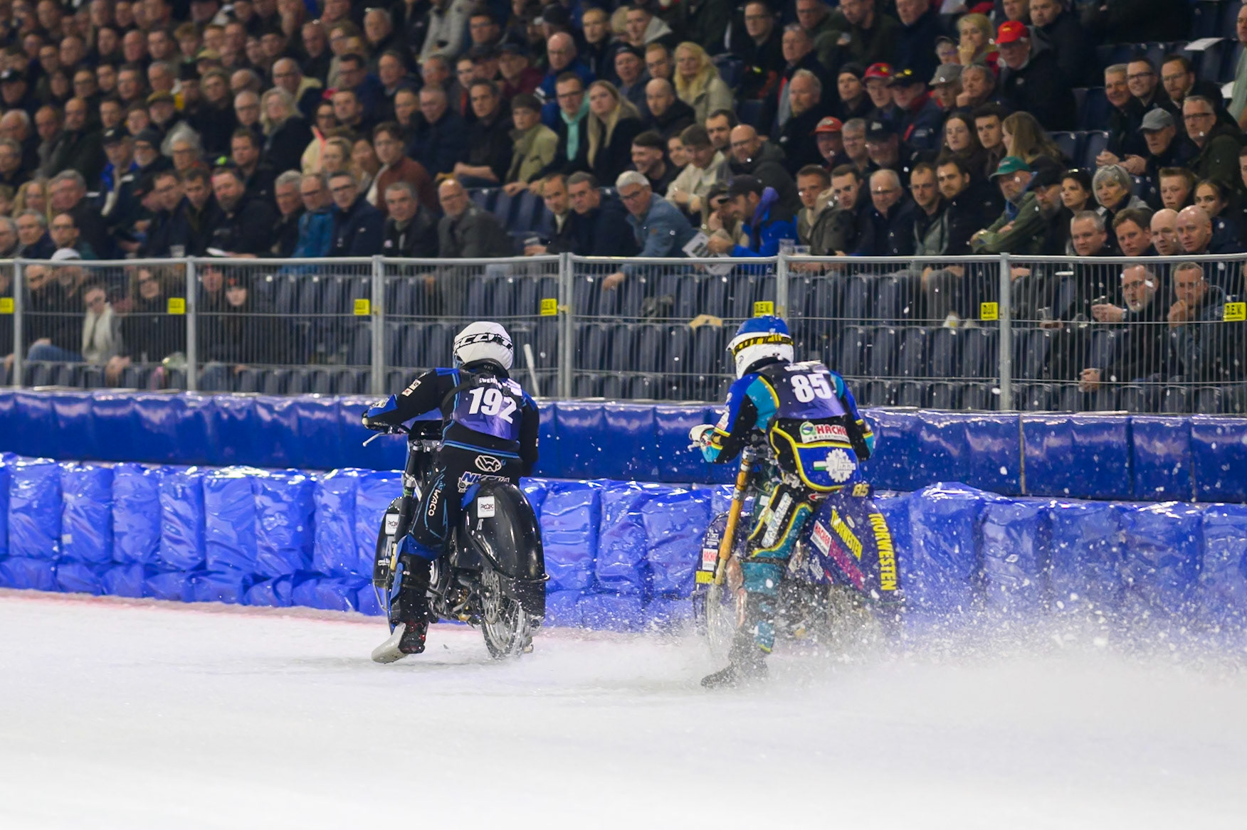 Luca Bauer (85) of Italy/Germany  in Blue chases Niclas Svensson (192) of Sweden  in White during the FIM Ice Speedway Gladiators World Championship Final 3 at Ice Rink Thialf, Heerenveen on Saturday 11th April 2026. (Photo: Ian Charles | MI News)