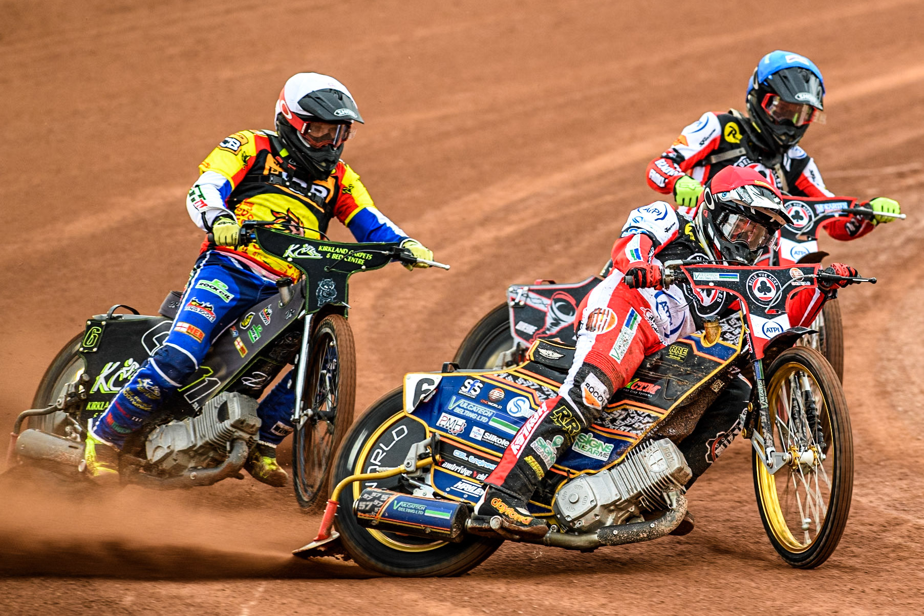 Belle Vue Aces' Connor Mountain in Red leading Leicester Lions' Craig Cook in White and Belle Vue Aces' Connor Bailey in Blue during the Rowe Motor Oil Premiership match between Belle Vue Aces and Leicester Lions at the National Speedway Stadium, Manchester on Monday 24th June 2024. (Photo: Ian Charles | MI News)