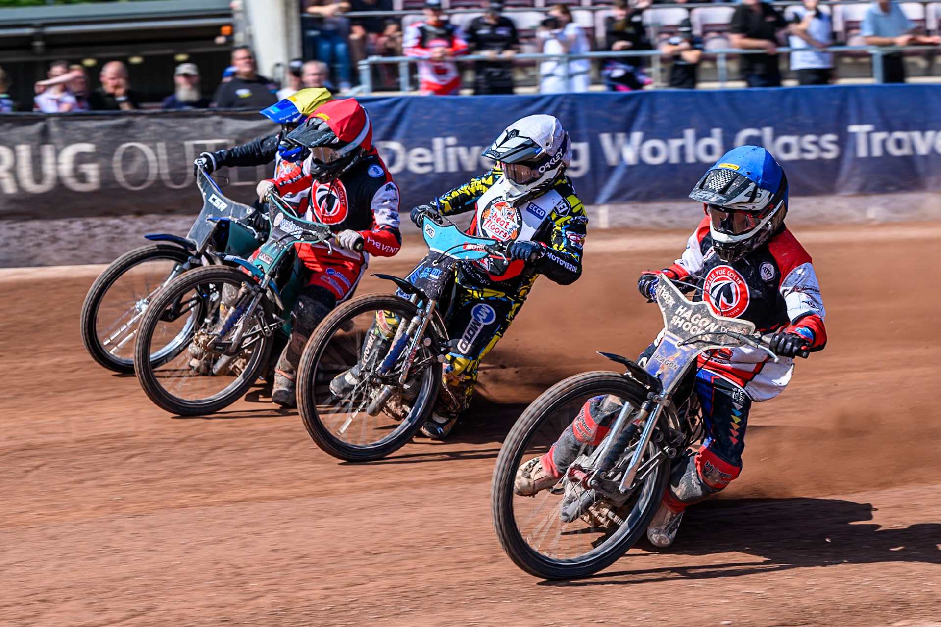 Harry Fletcher of Belle Vue Colts  in Blue rides inside Jamie Halder of Middlesborough Tigers  w, Mason Watson of Belle Vue Colts  in Red and Charlie Southwick of Middlesborough Tigers  in Yellow during the WSRA National Development League match between Belle Vue Colts and Middlesbrough Tigers at the National Speedway Stadium, Manchester on Sunday 10th August 2025. (Photo: Mark Fletcher | MI News)