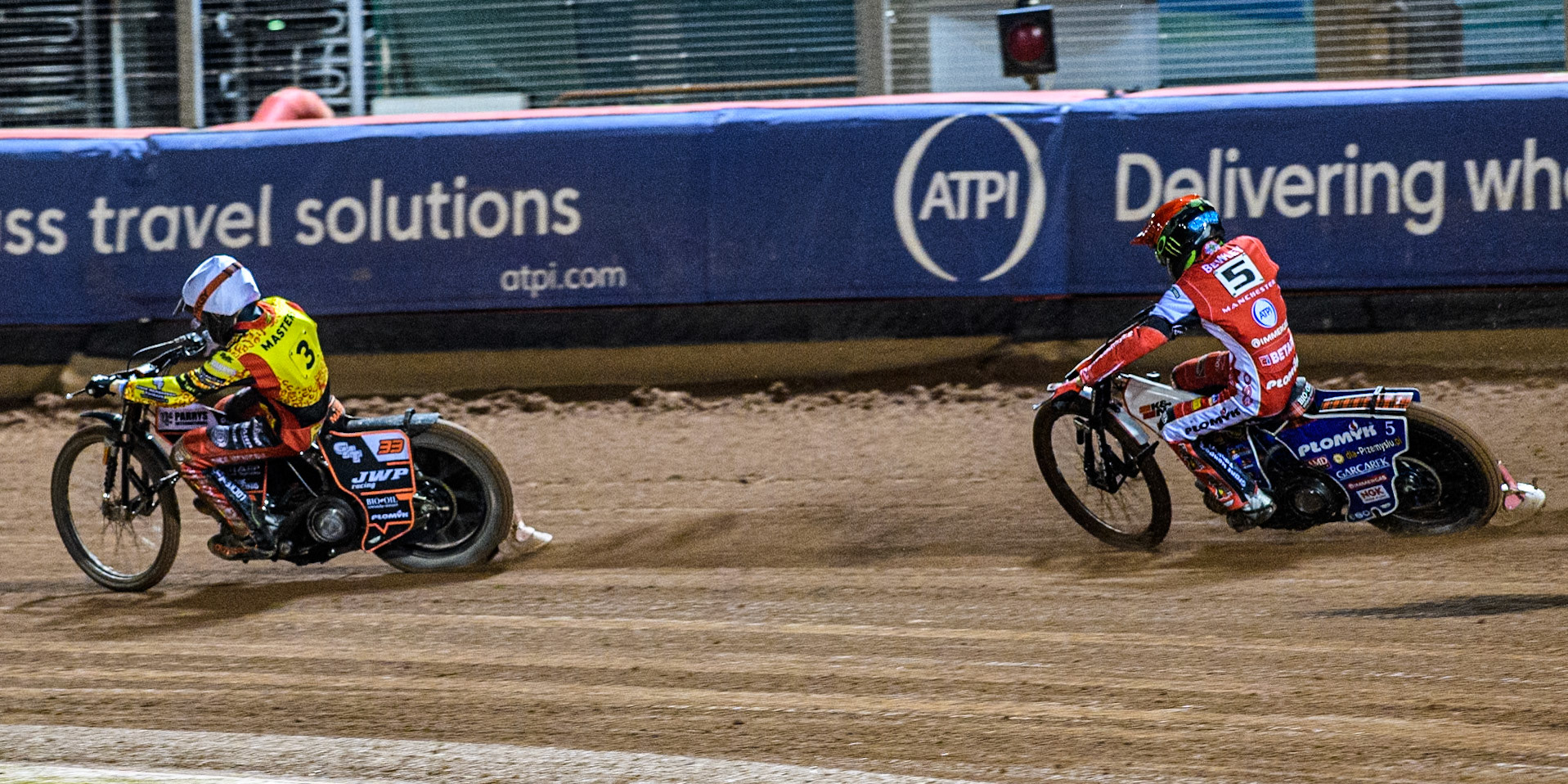 Belle Vue Aces' Dan Bewley  in Red chases Leicester Lions' Sam Masters  in White during the Rowe Motor Oil Premiership Grand Final 1st Leg between Belle Vue Aces and Leicester Lions at the National Speedway Stadium, Manchester on Monday 23rd September 2024. (Photo: Ian Charles | MI News)