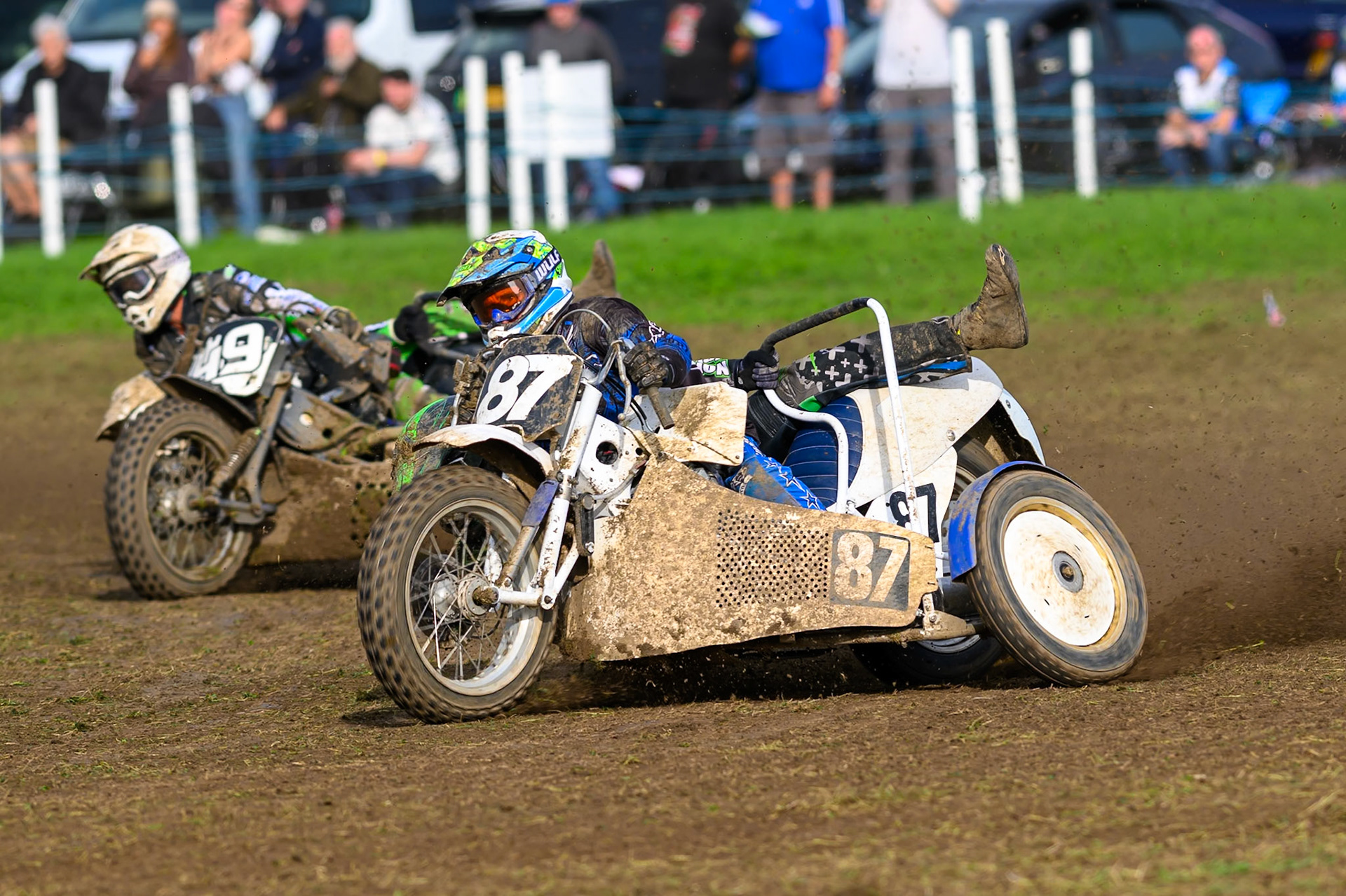 British Masters 1000cc Sidecars: Rob Bradley/Billy Winterburn (87) leading Gareth Winterburn/Frankie Courtney (49) during the British Masters Grasstrack Championship at Lower Marsh Farm, Much Hoole, Preston in Lancashire, England on Sunday 13th September 2026. (Photo: Ian Charles | MI News)